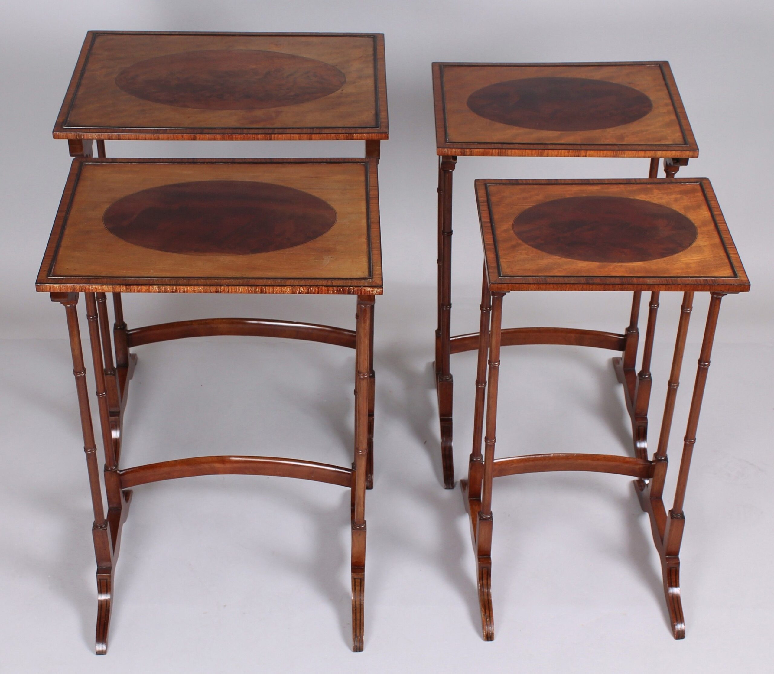 Edwardian Sheraton Revival satinwood and mahogany quartetto tables