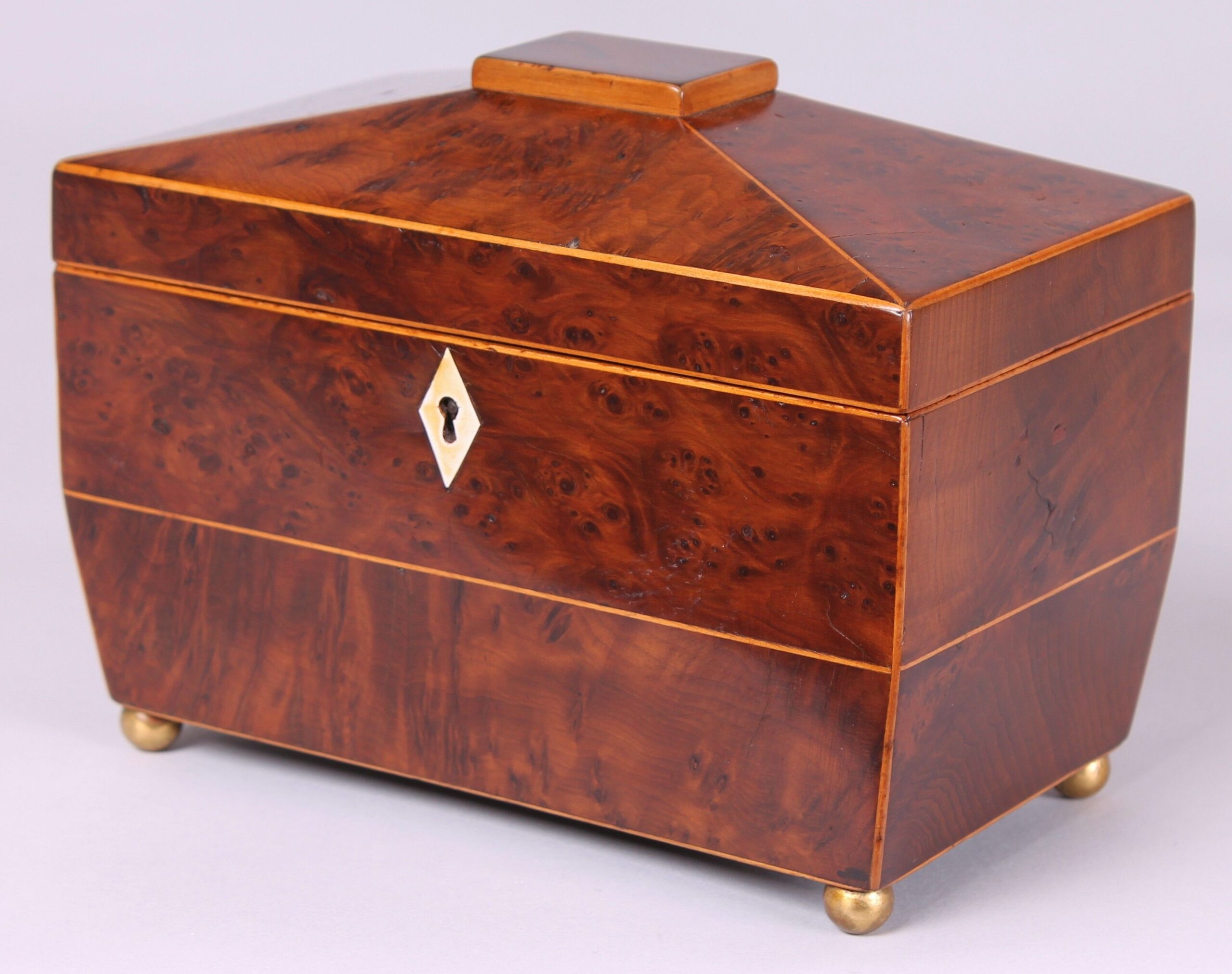 George IV period yew wood sarcophagus-shaped double tea caddy