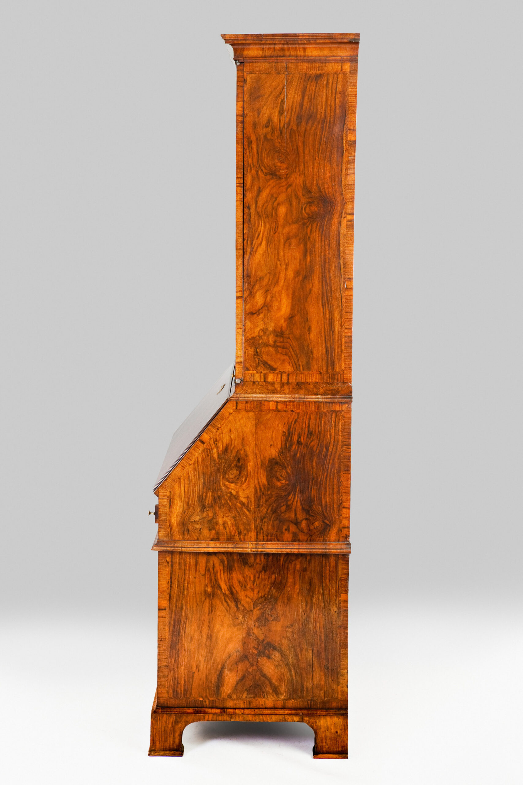 George II period burr walnut bureau-cabinet