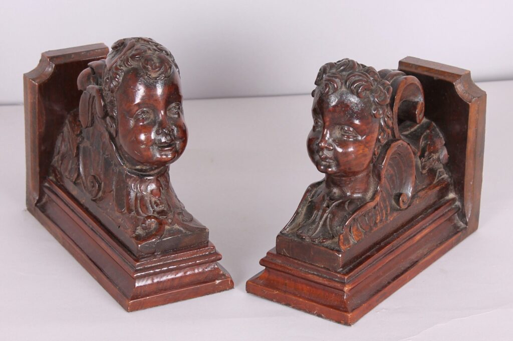 Two similar late seventeenth century carved walnut architectural fragments