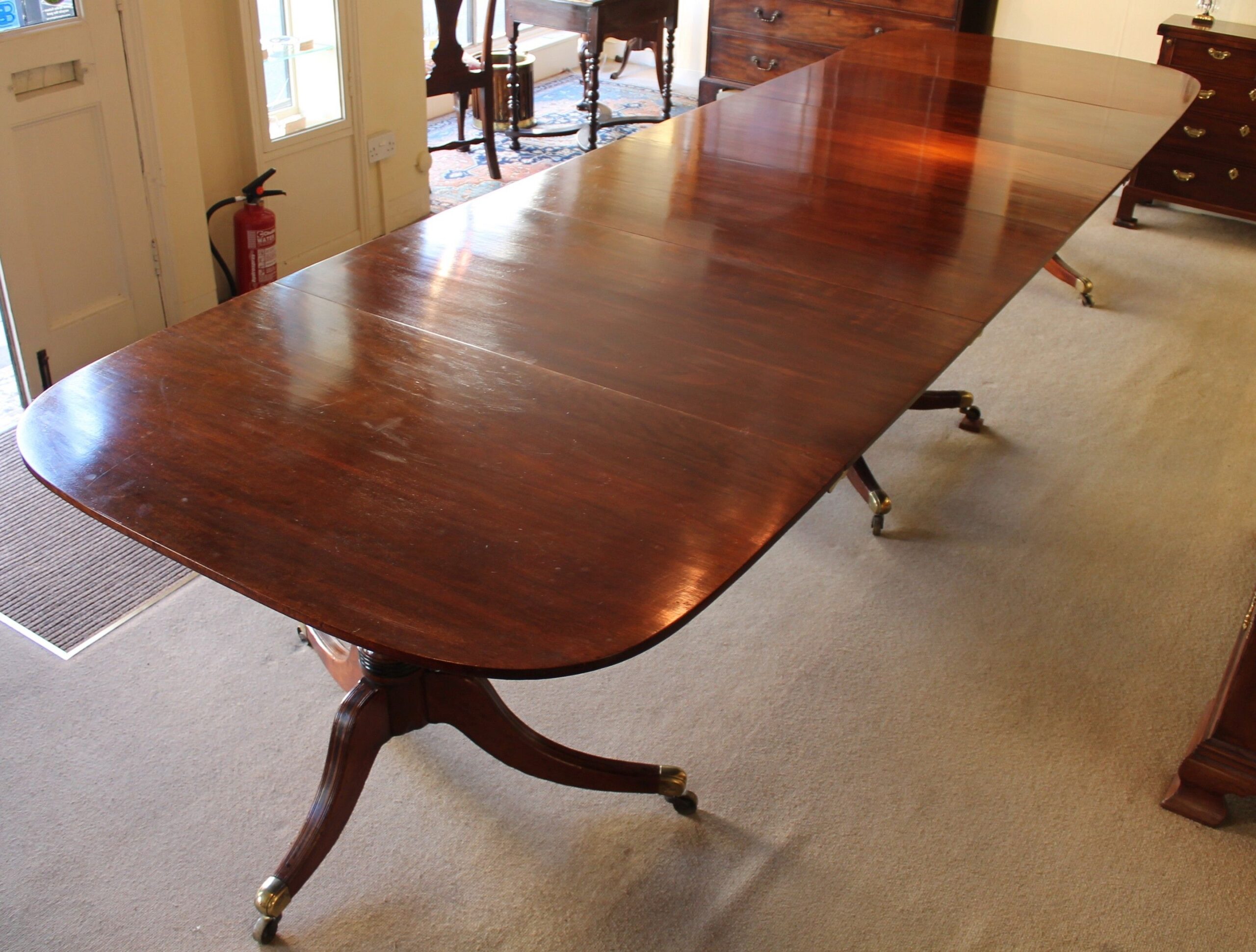 Rare Regency mahogany three-pedestal dining-table
