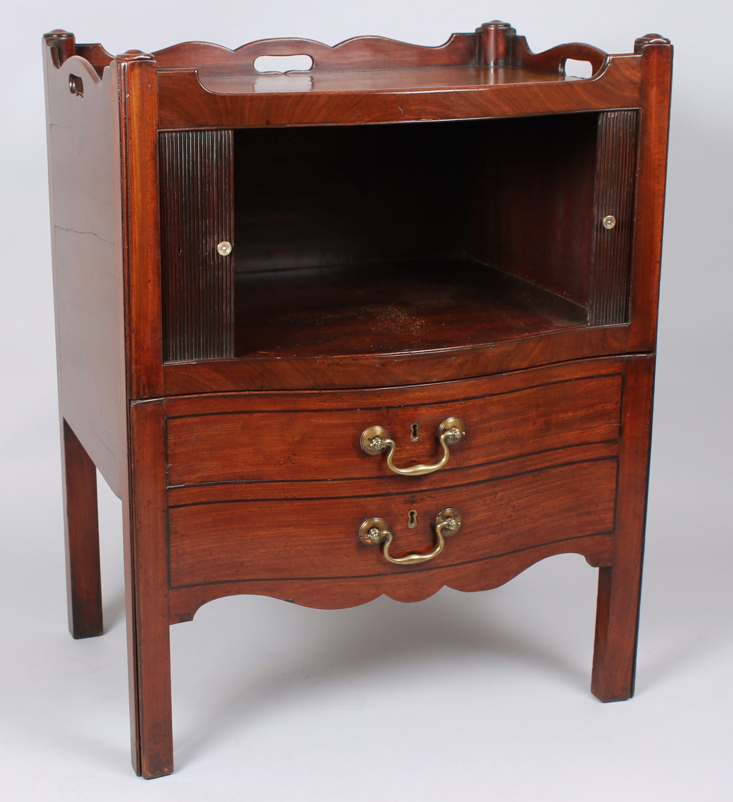 Rare George III period mahogany serpentine-fronted night-table
