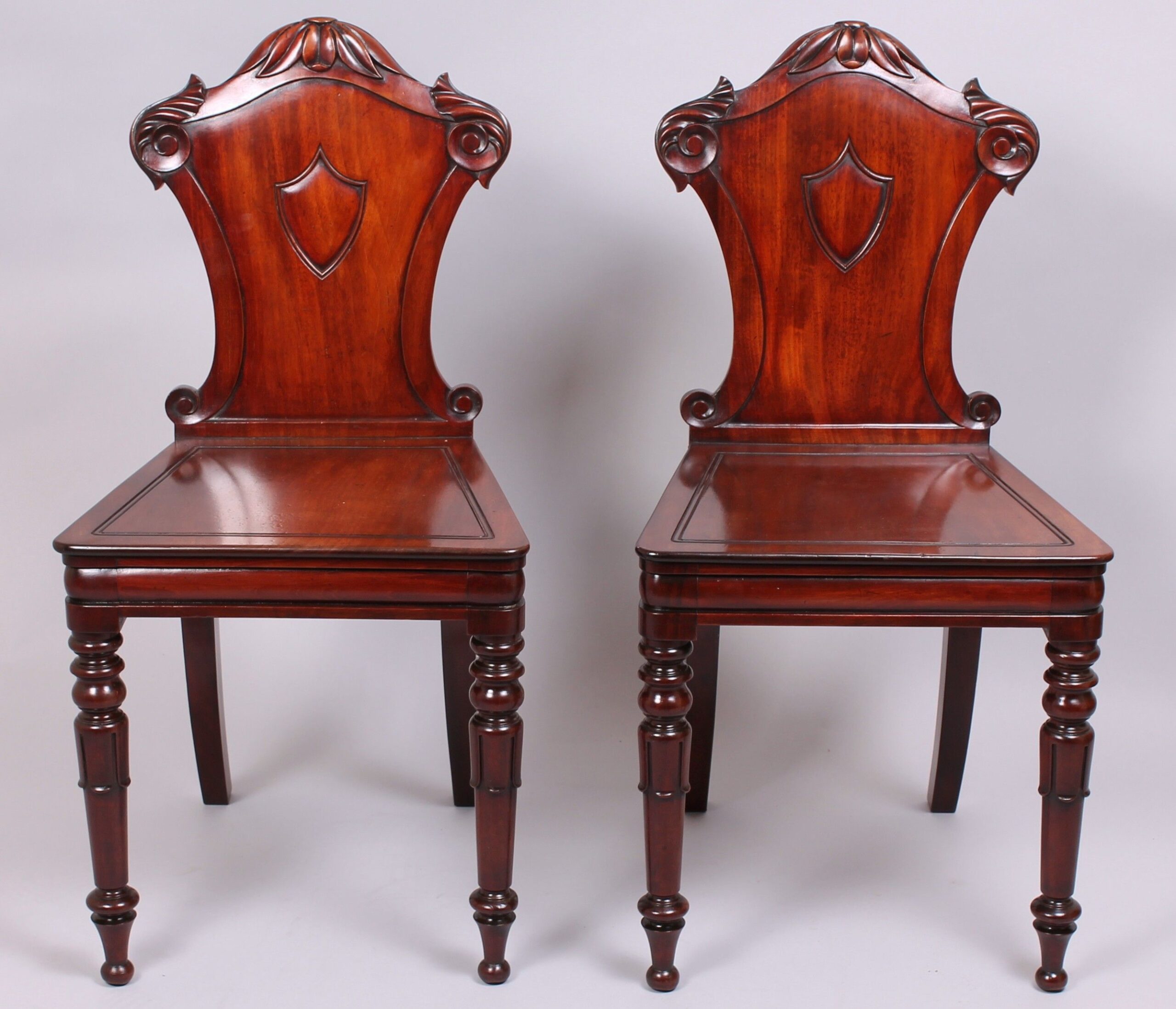 Pair of early 19th century mahogany hall-chairs