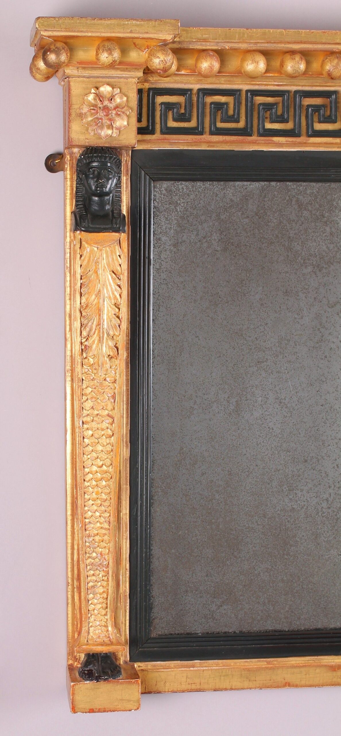 Fine Regency period gilt and ebonised overmantel mirror in the classical Egyptian taste
