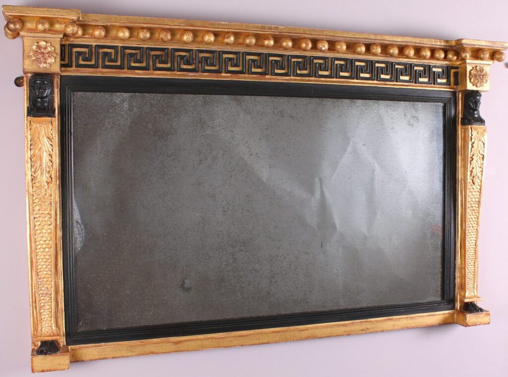 Fine Regency period gilt and ebonised overmantel mirror in the classical Egyptian taste