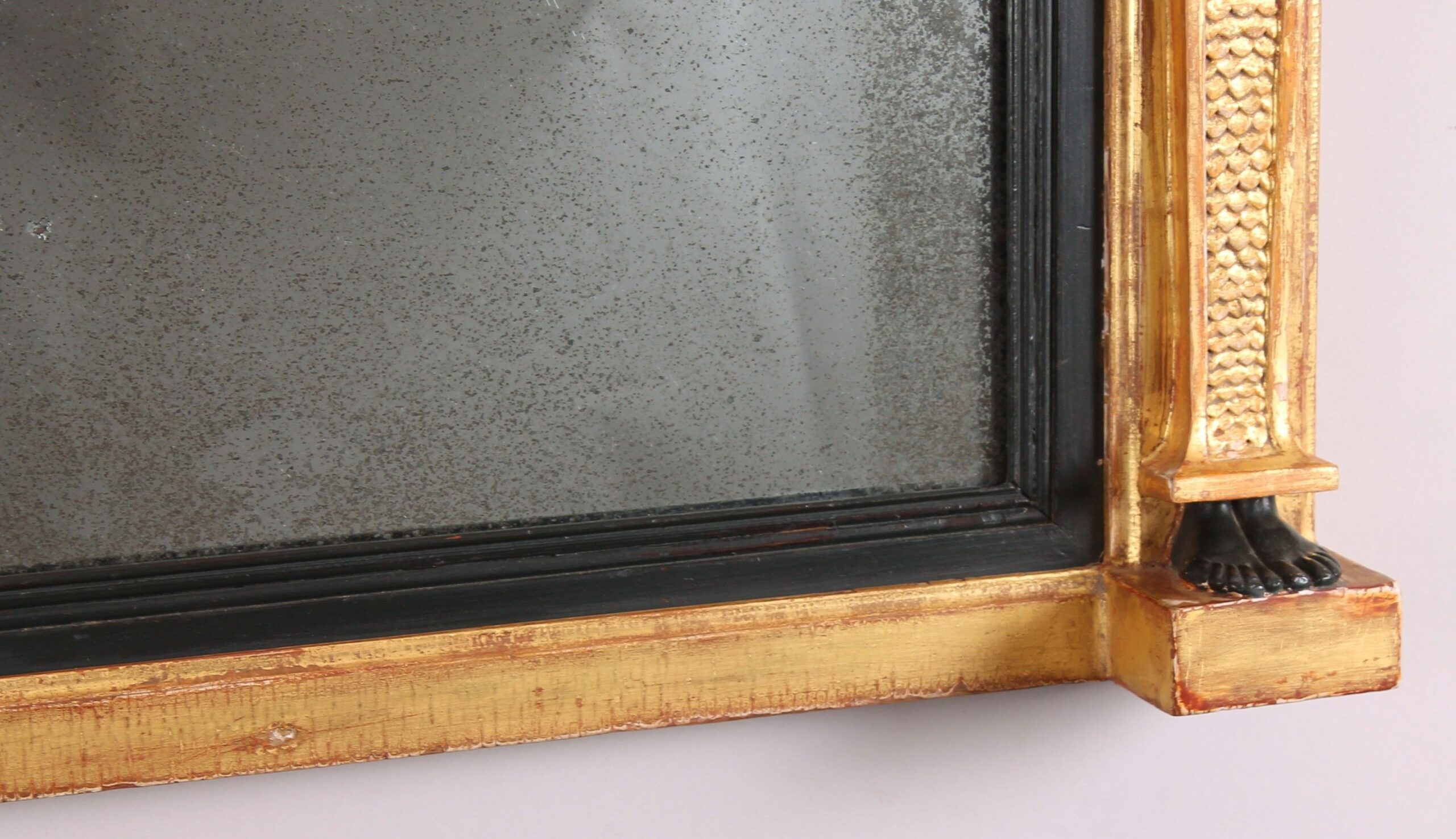 Fine Regency period gilt and ebonised overmantel mirror in the classical Egyptian taste