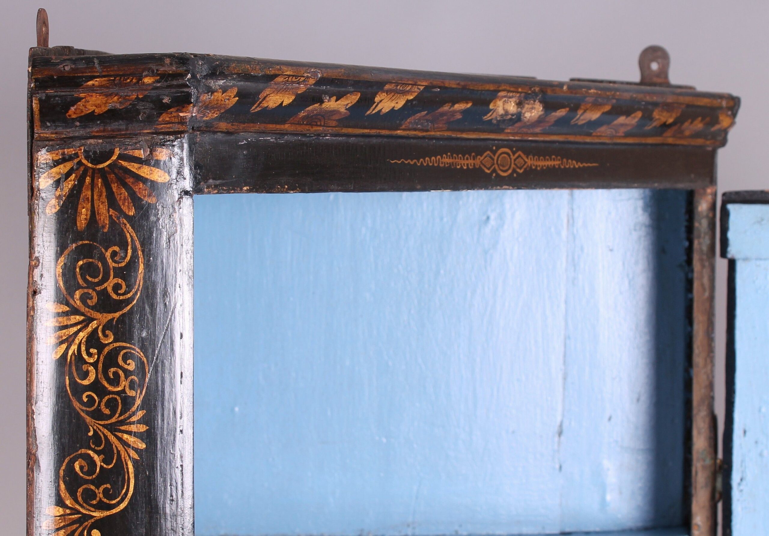 Early 18th century black and gold japanned corner-cupboard