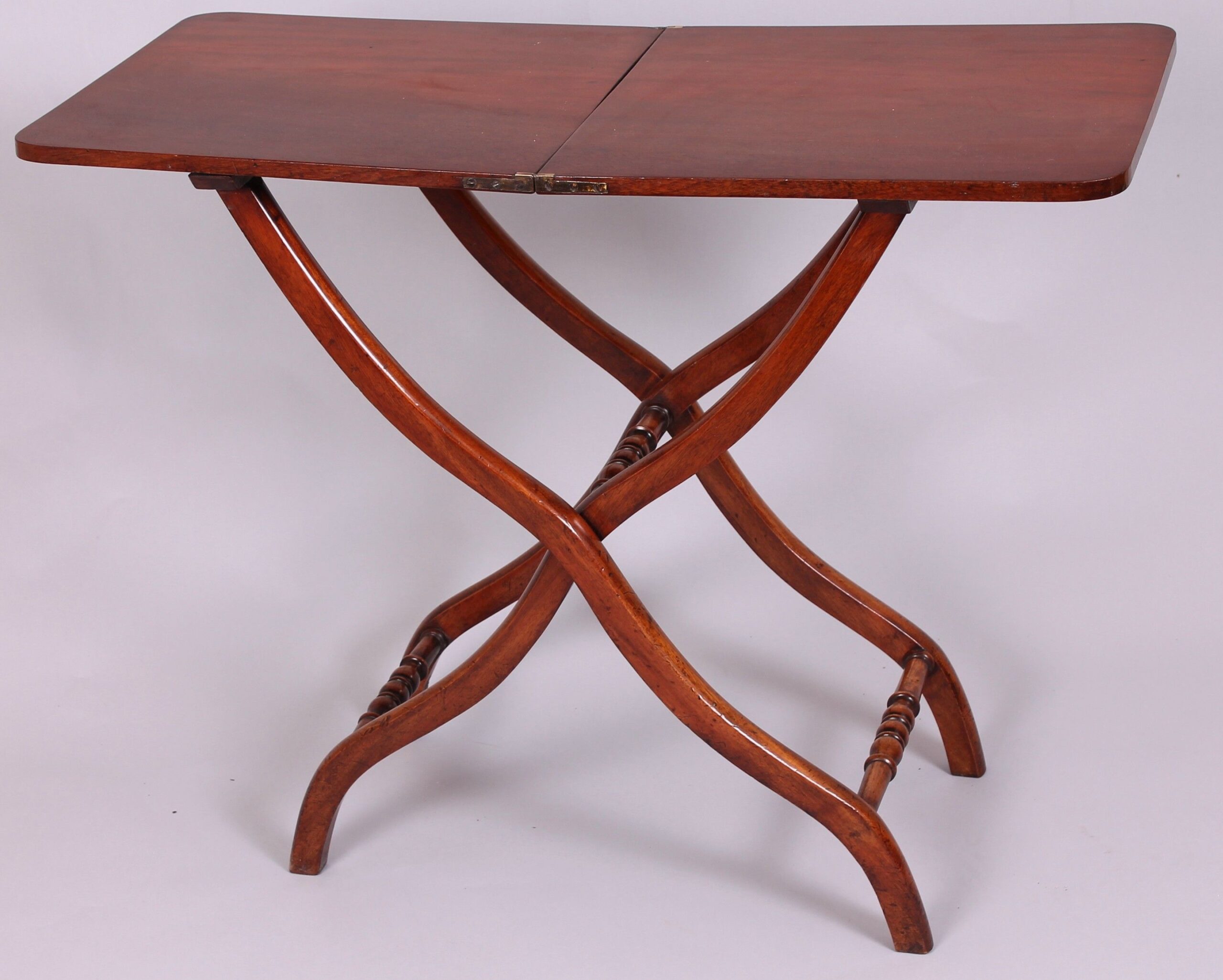 A matched pair of 19th century mahogany ‘coaching’ tables