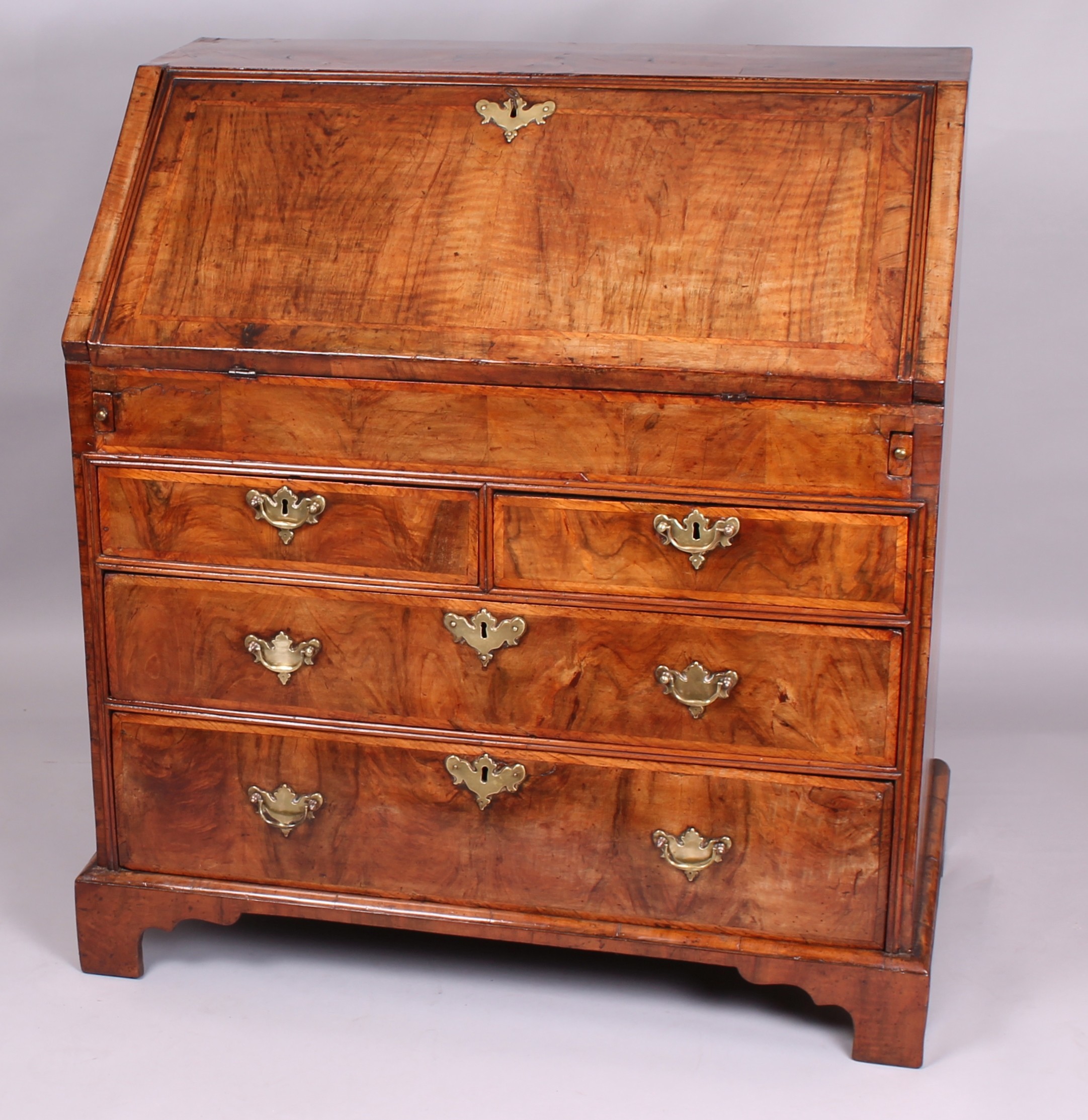 Early eighteenth century walnut bureau of pleasing golden colour and good patia