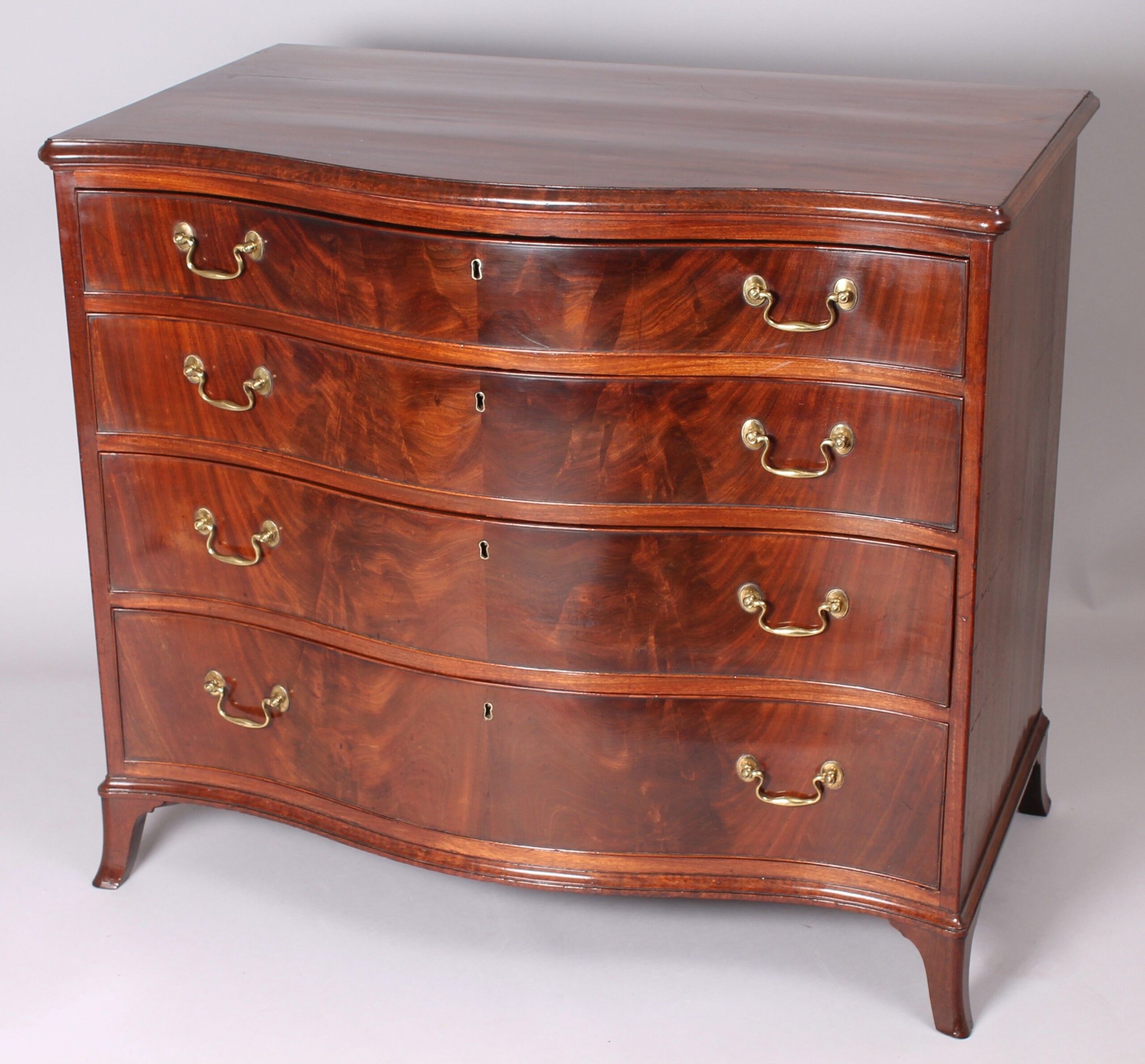 George III period mahogany serpentine-fronted mahogany chest-of-drawers of high quality