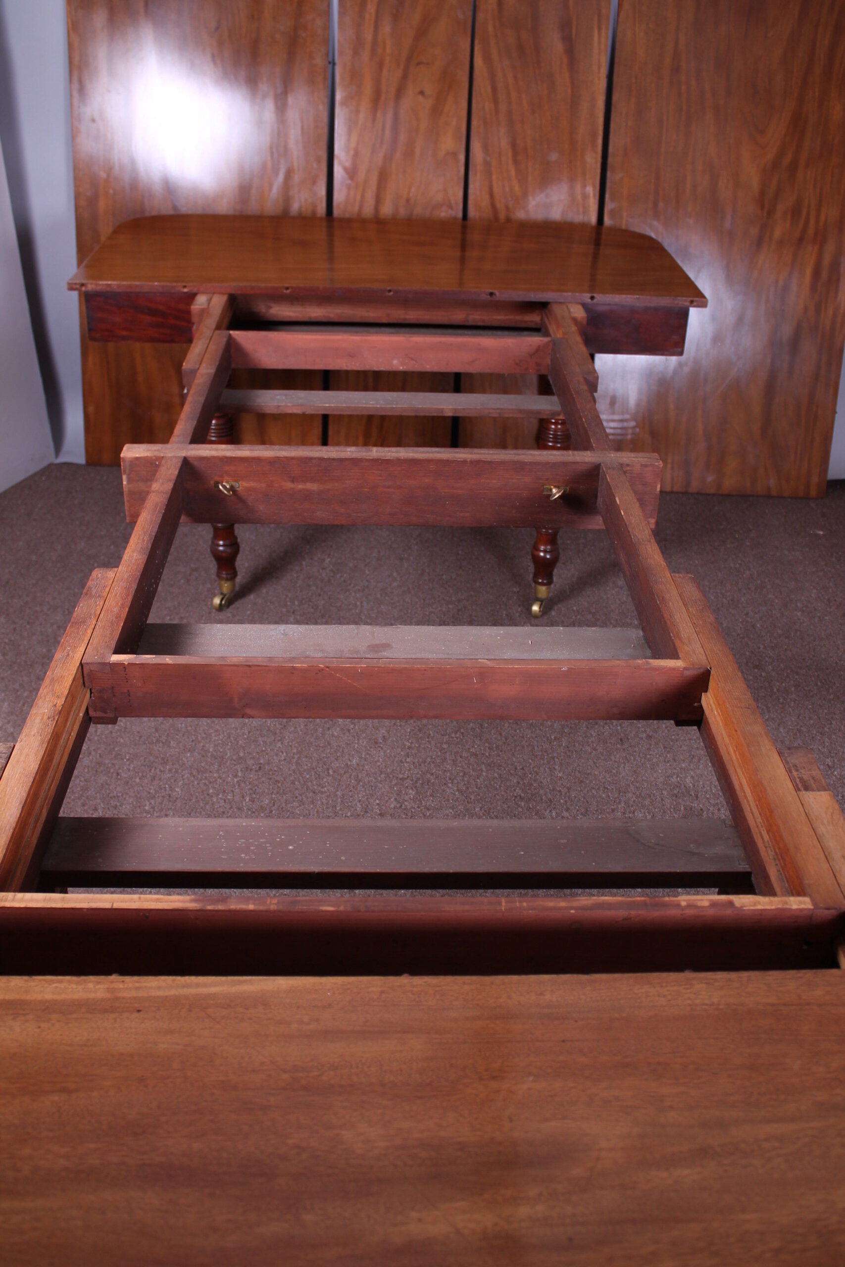A good George IV period golden mahogany extending dining-table