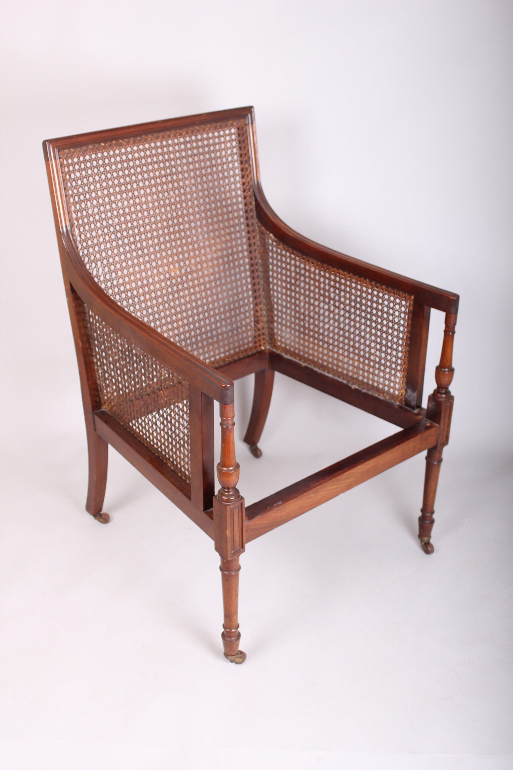 Late 19th century mahogany library bergere in the Regency manner
