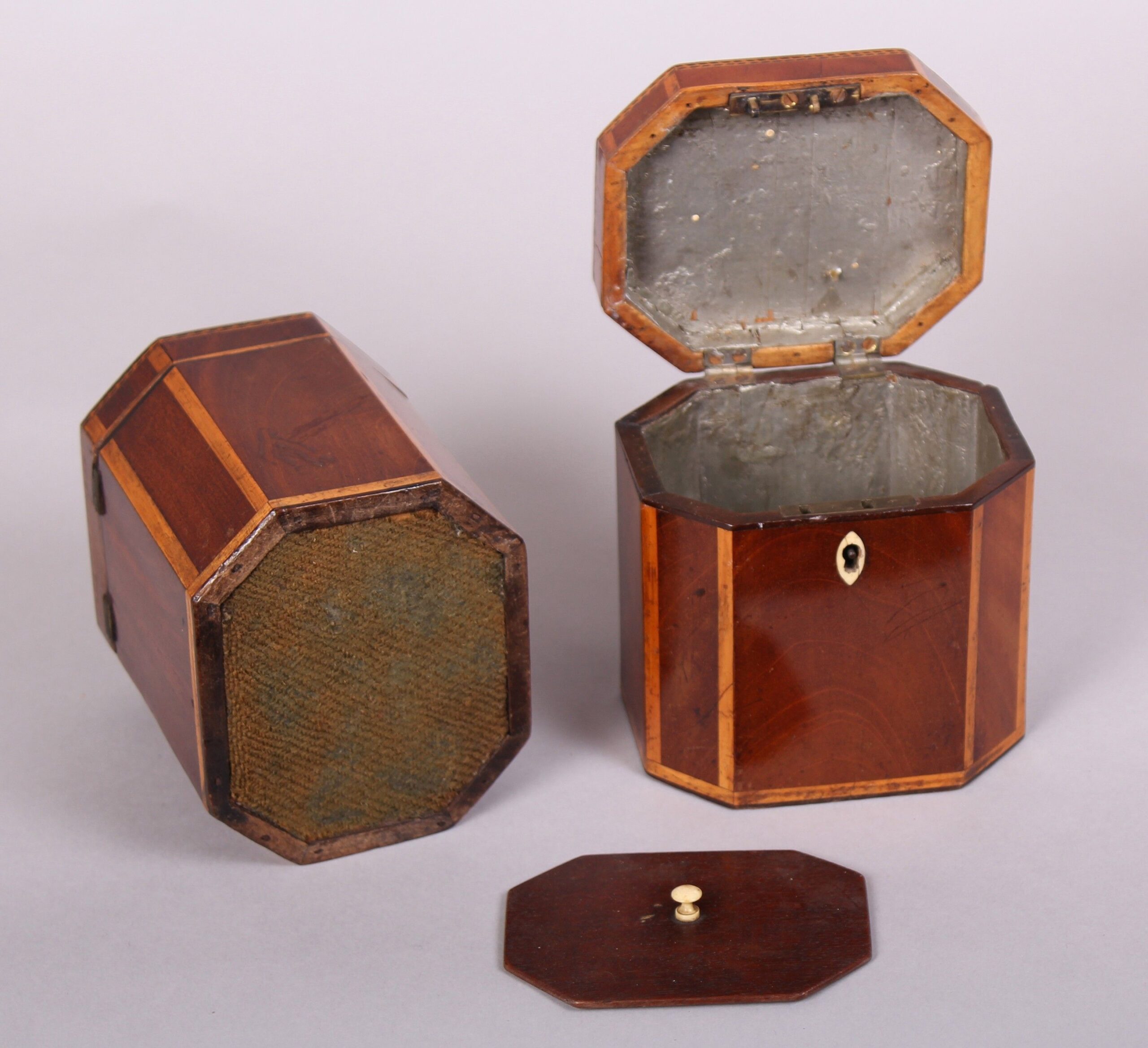 Rare pair of George III period mahogany small octagonal tea-caddies