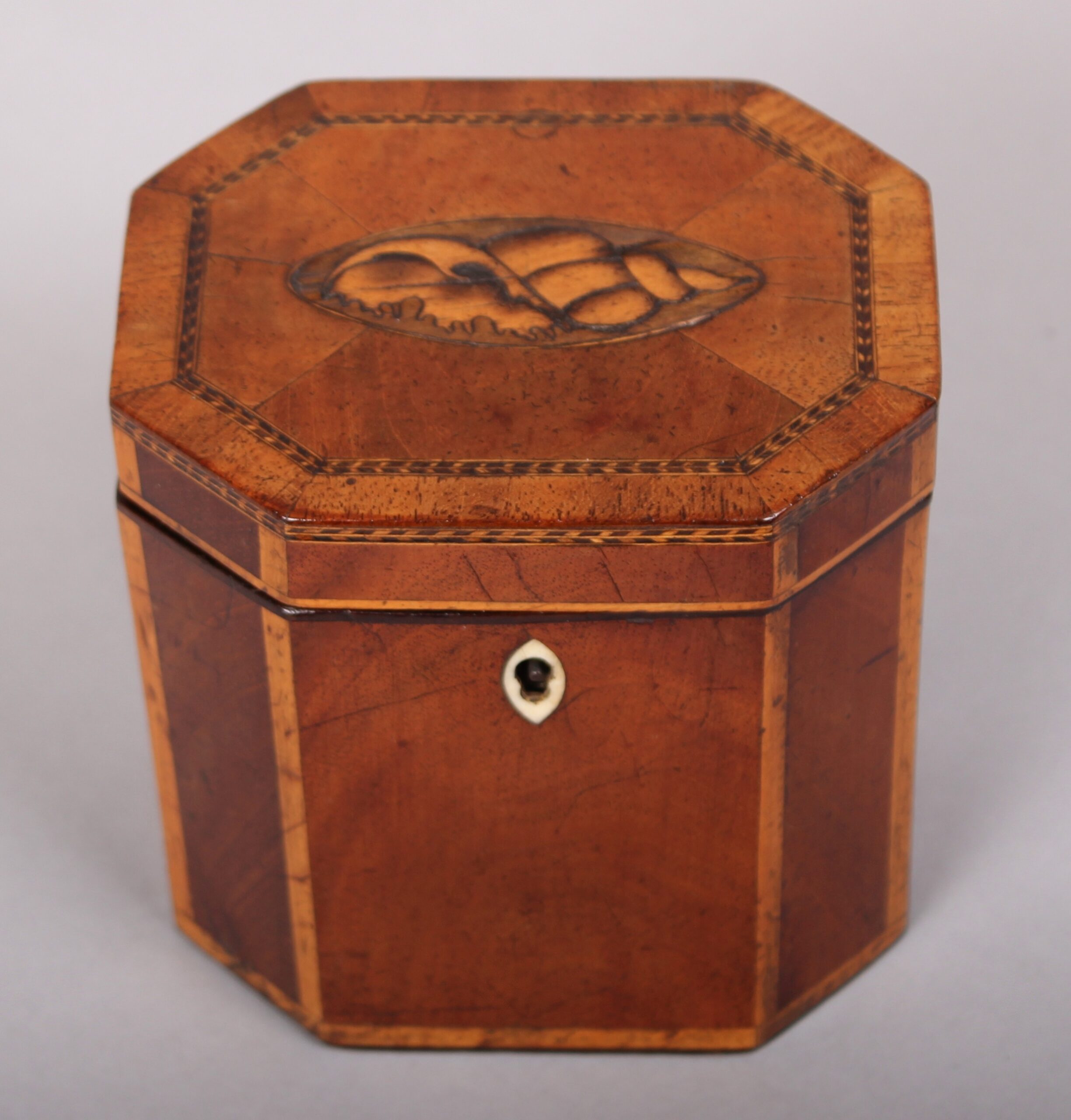 Rare pair of George III period mahogany small octagonal tea-caddies
