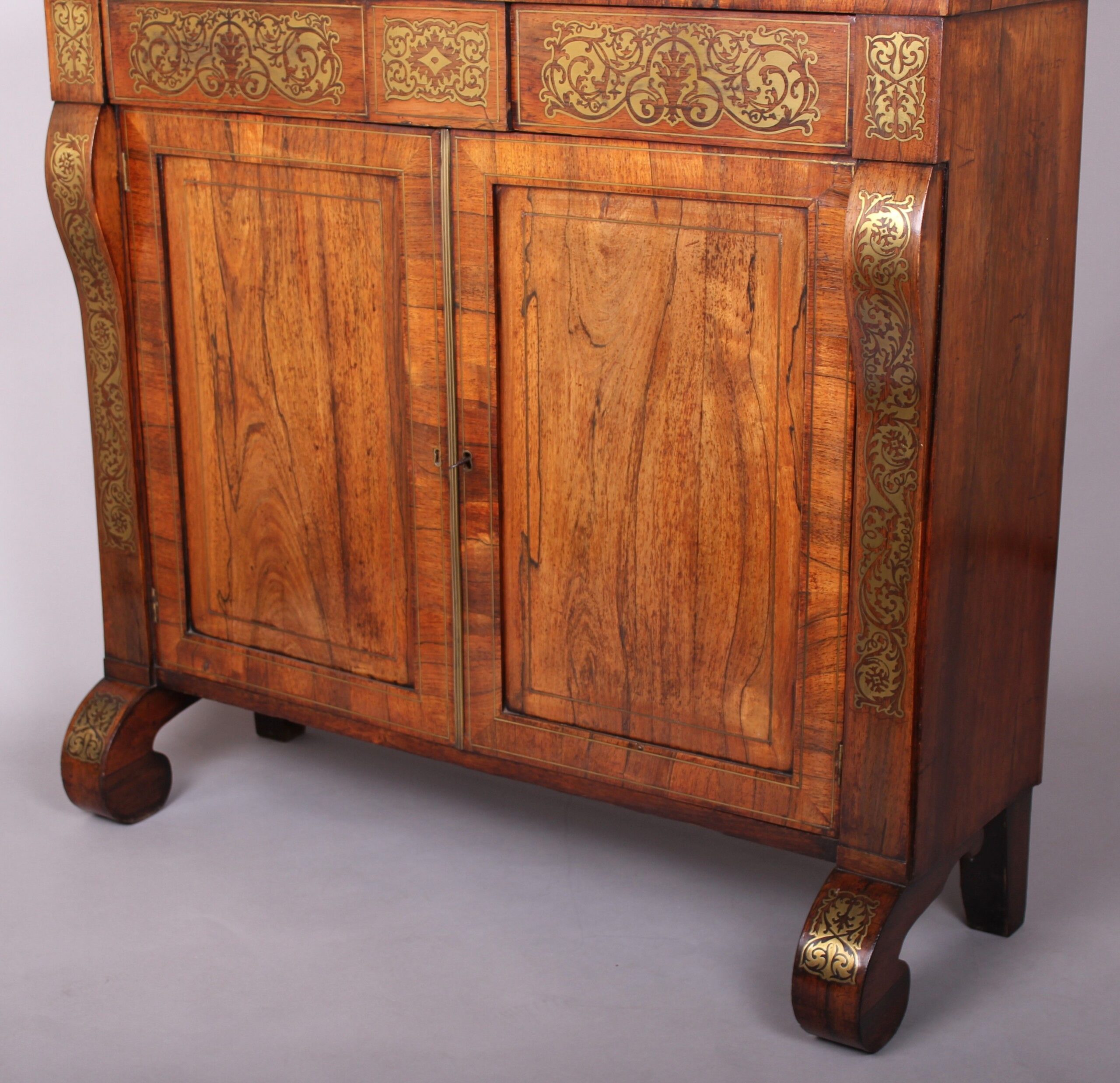 Regency period rosewood and brass inlaid chiffonier