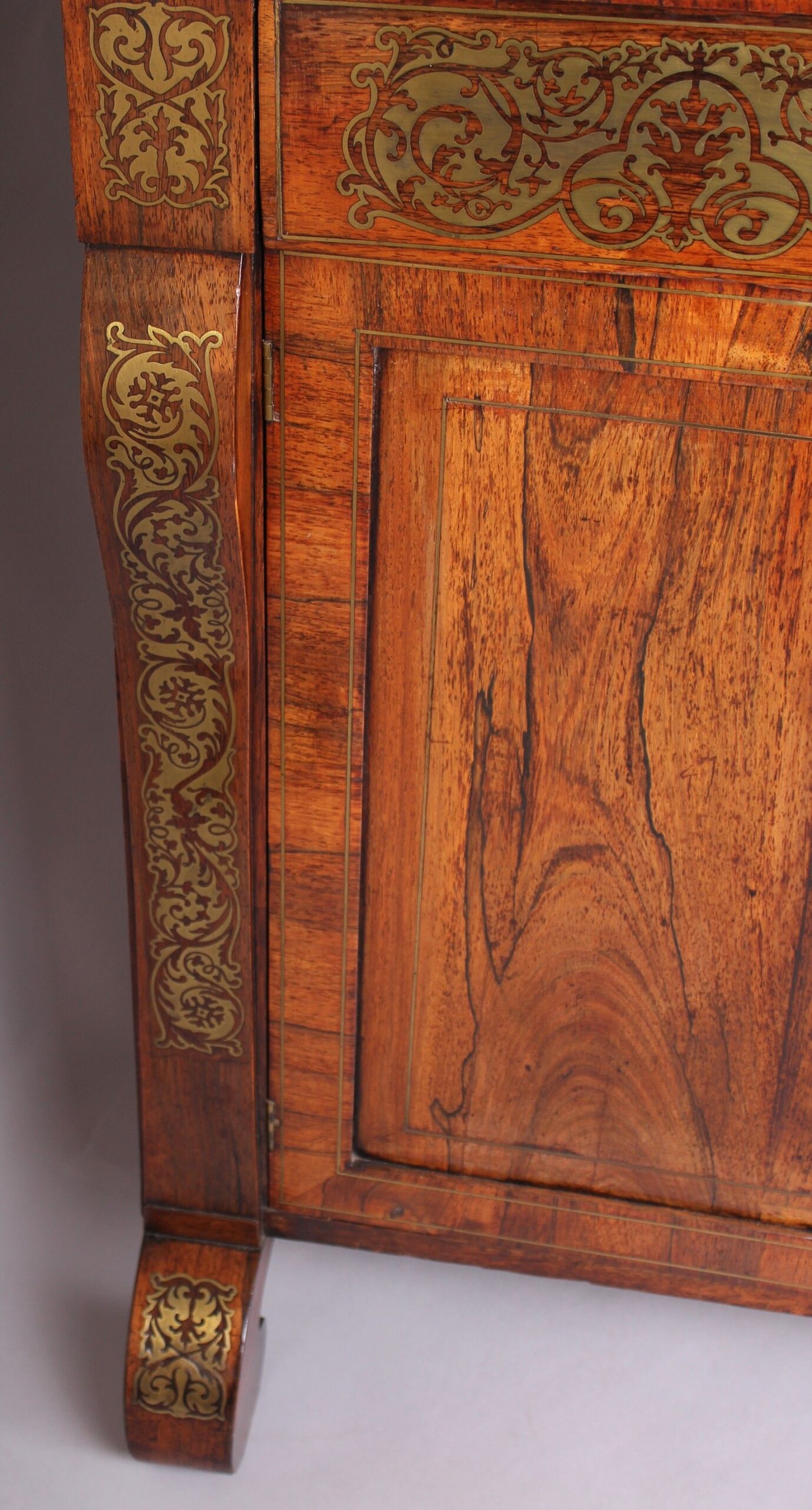 Regency period rosewood and brass inlaid chiffonier