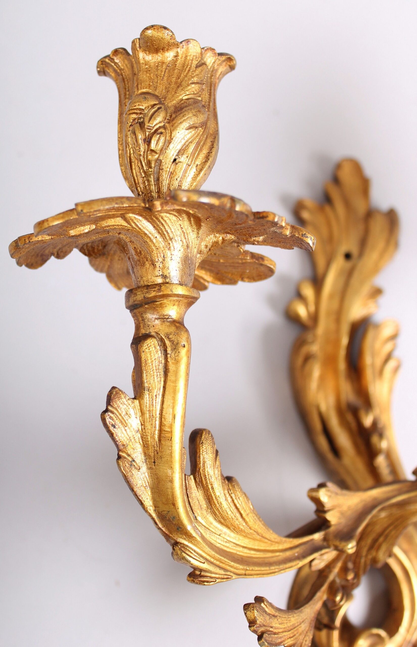 Pair of gilt-brass wall-lights in the Louis XV Rococo style