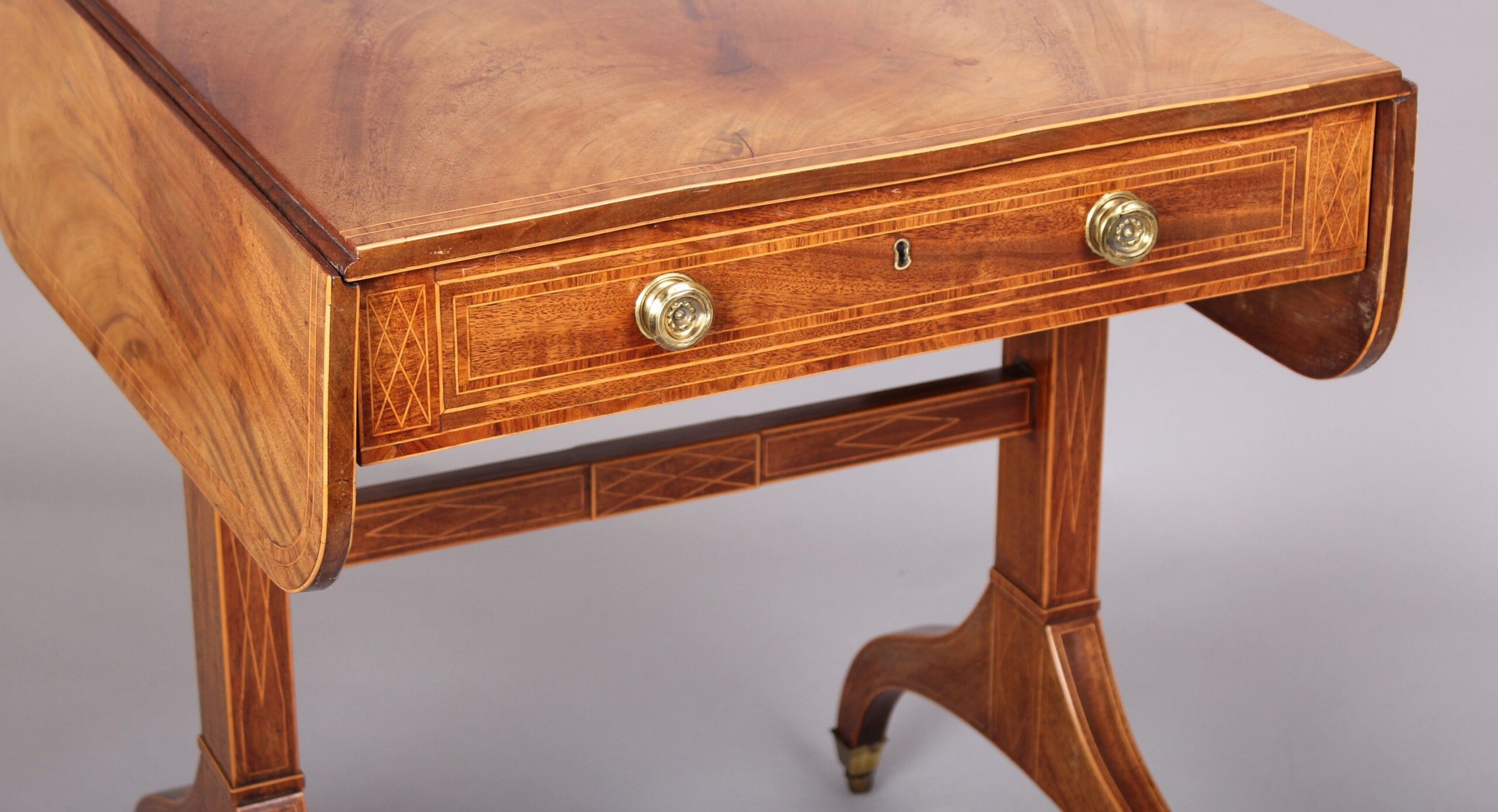 Rare and fine quality George III period mahogany sofa-table of diminutive proportions