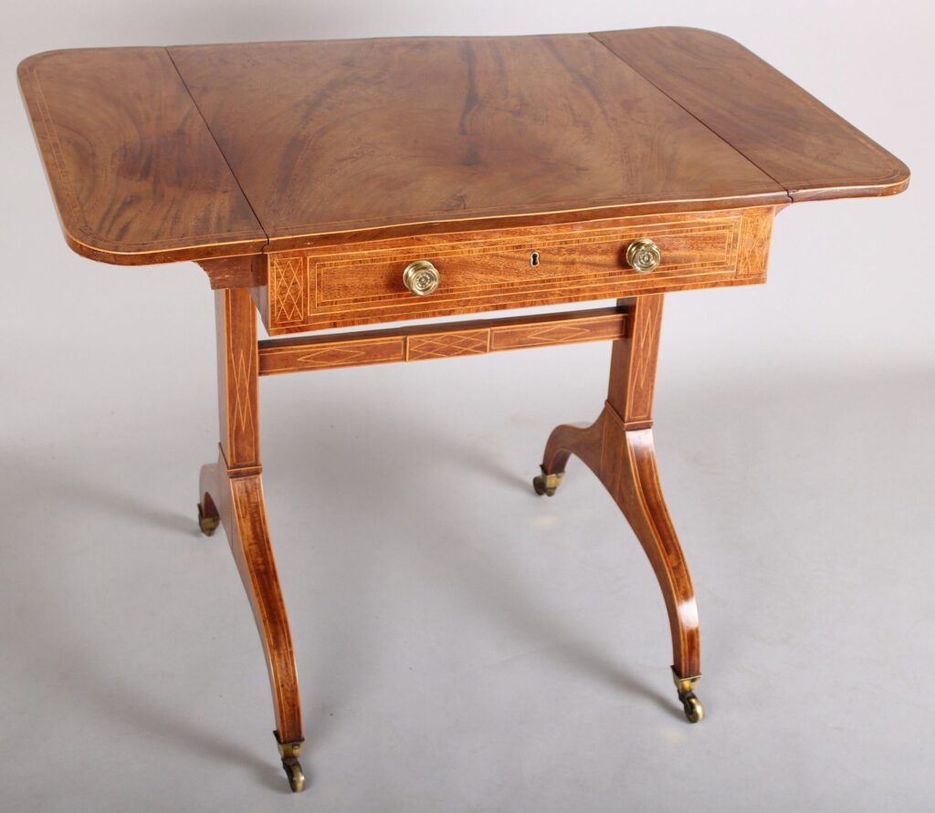 Rare and fine quality George III period mahogany sofa-table of diminutive proportions