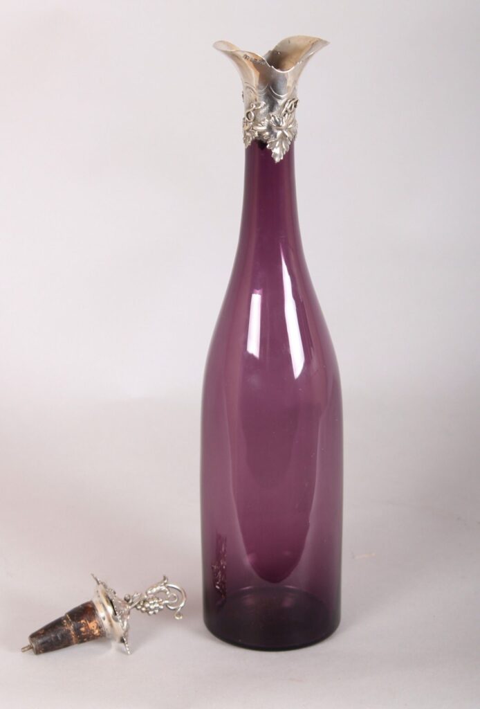 Victorian silver-mounted amethyst glass bottle shaped decanter and stopper