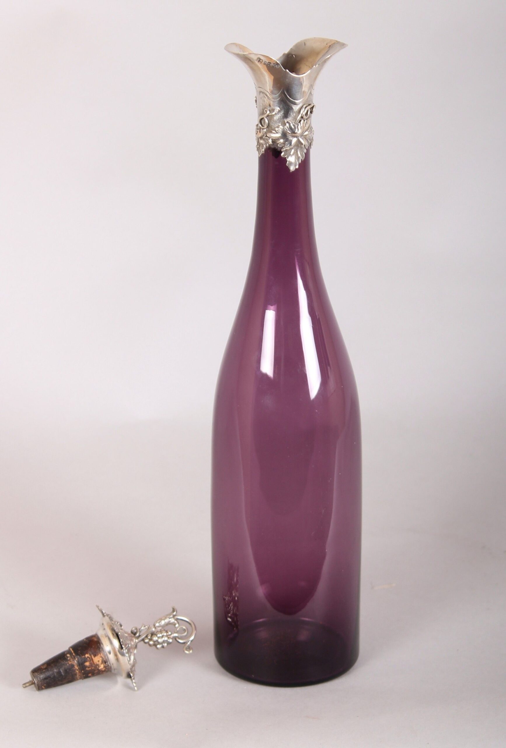 Victorian silver-mounted amethyst glass bottle shaped decanter and stopper