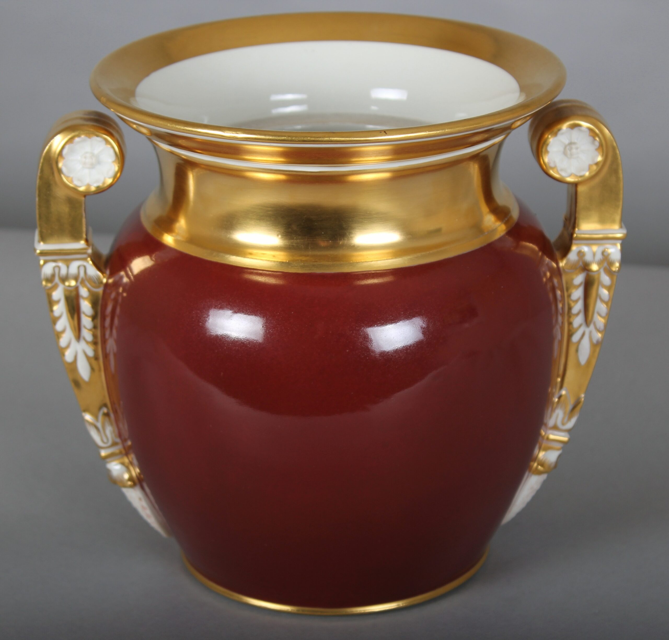 An early 19th century Brussels porcelain vase of Greek form