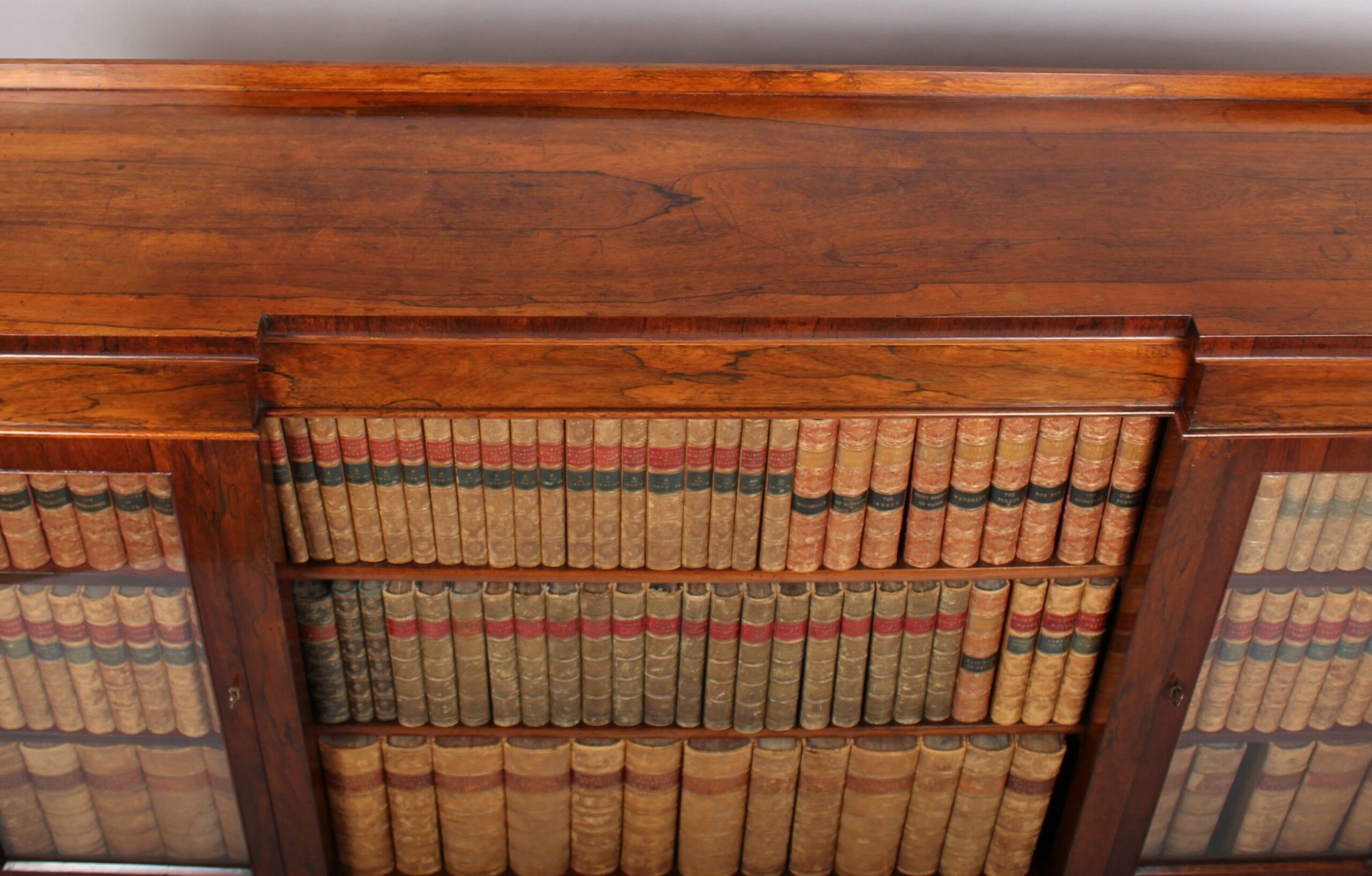 William IV period rosewood inverted-breakfront bookcase/side cabinet