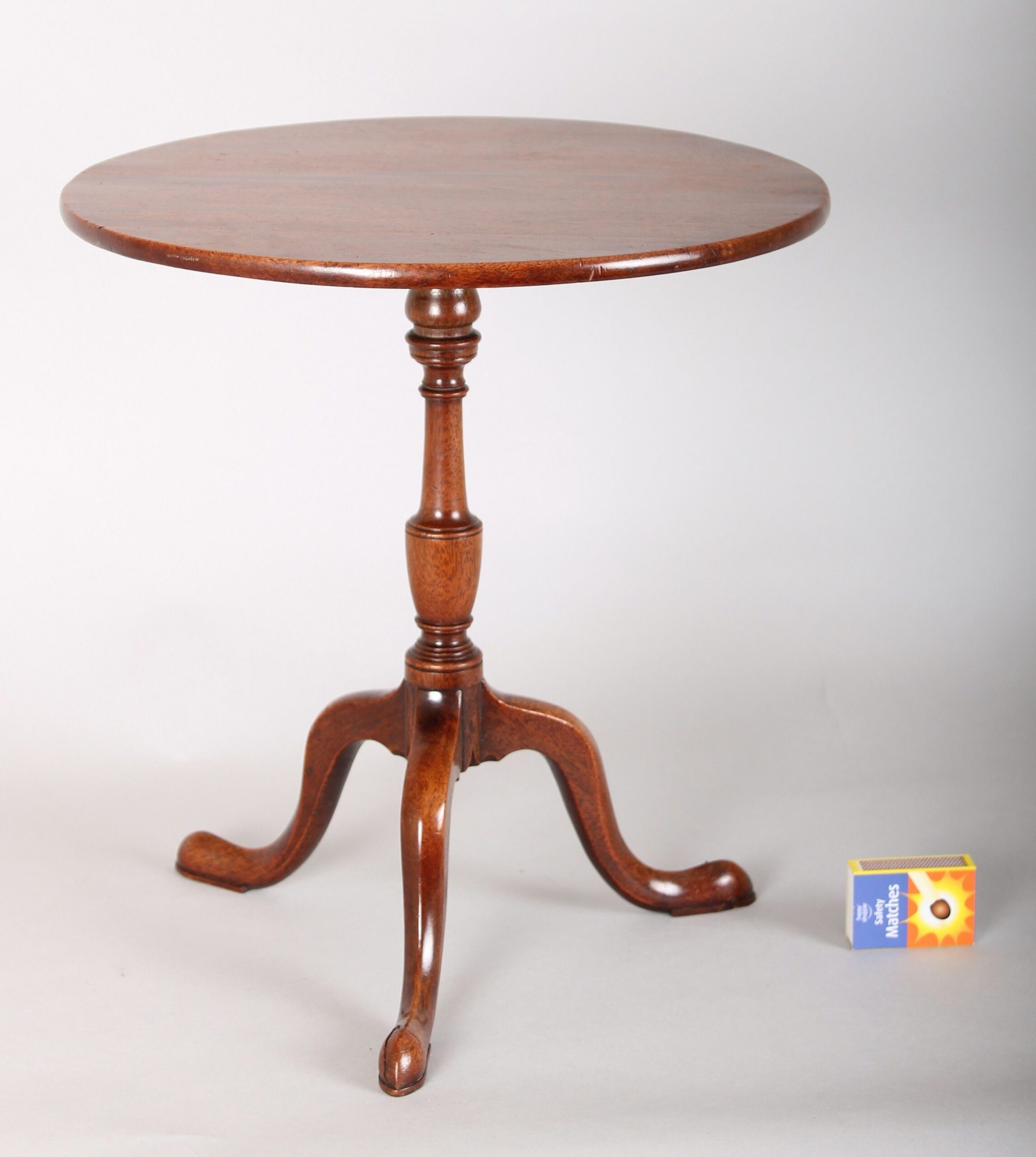 A most unusual George III period miniature mahogany tripod table
