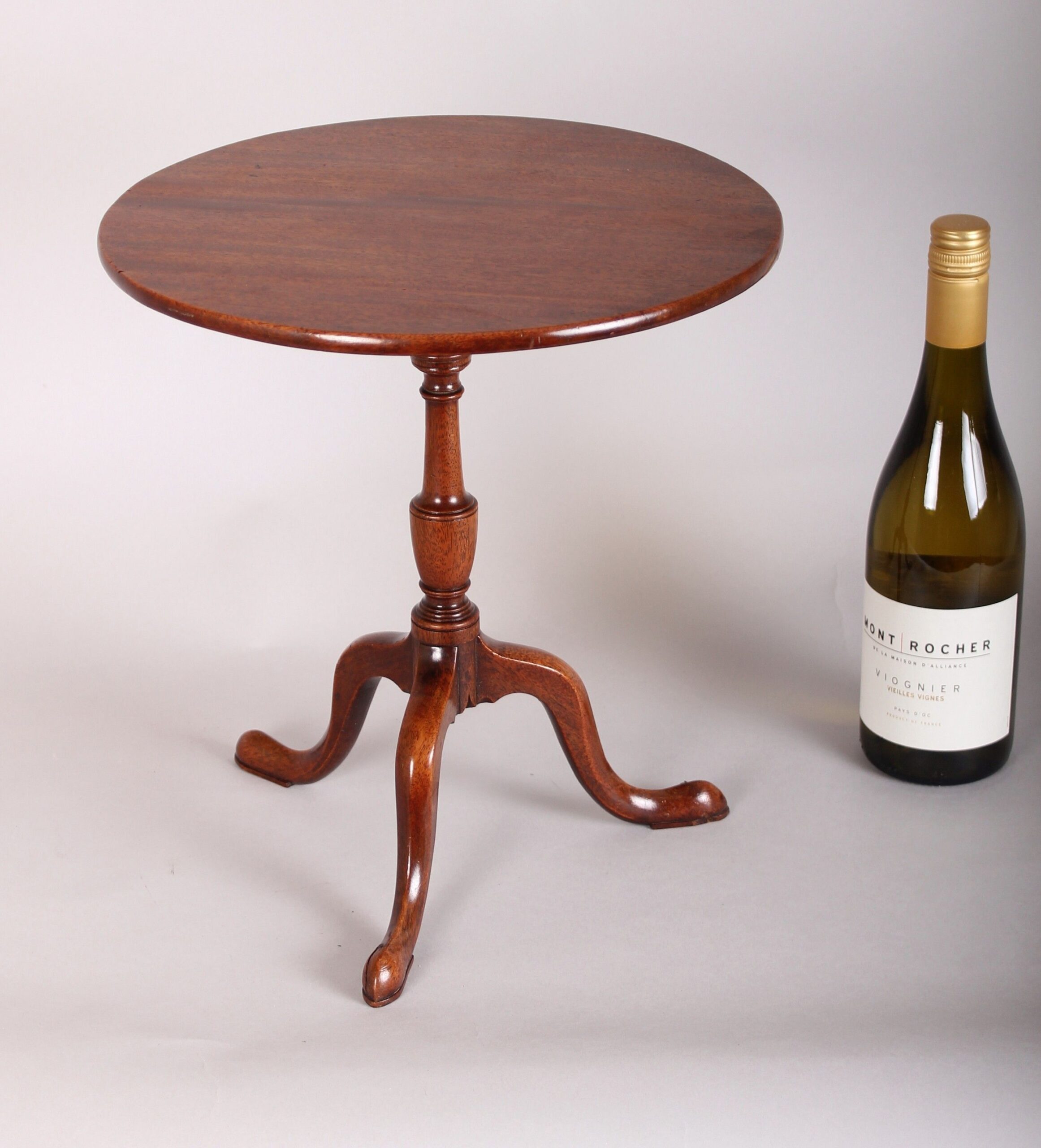 A most unusual George III period miniature mahogany tripod table