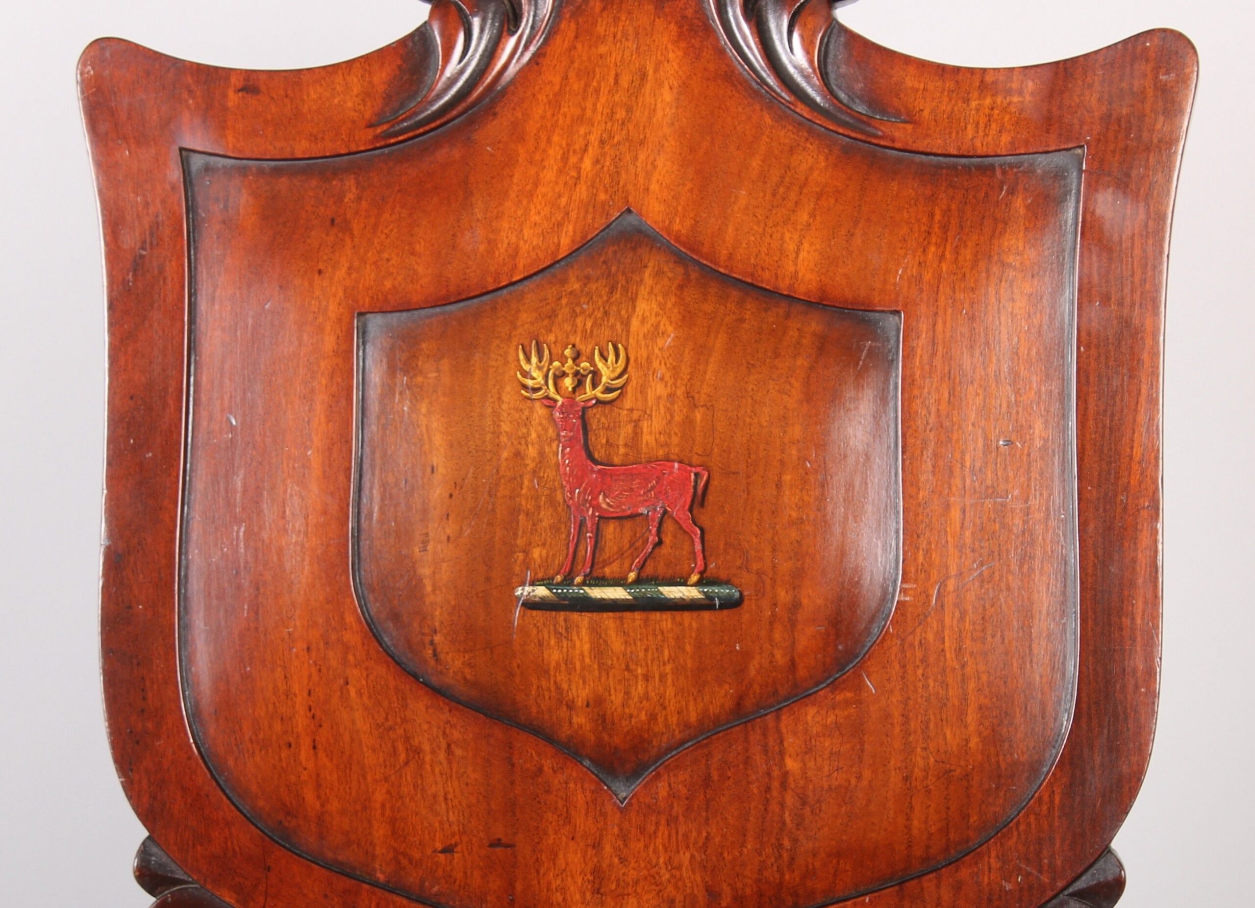 A fine pair of George IV period mahogany hall-chairs in the manner of T & G Seddon