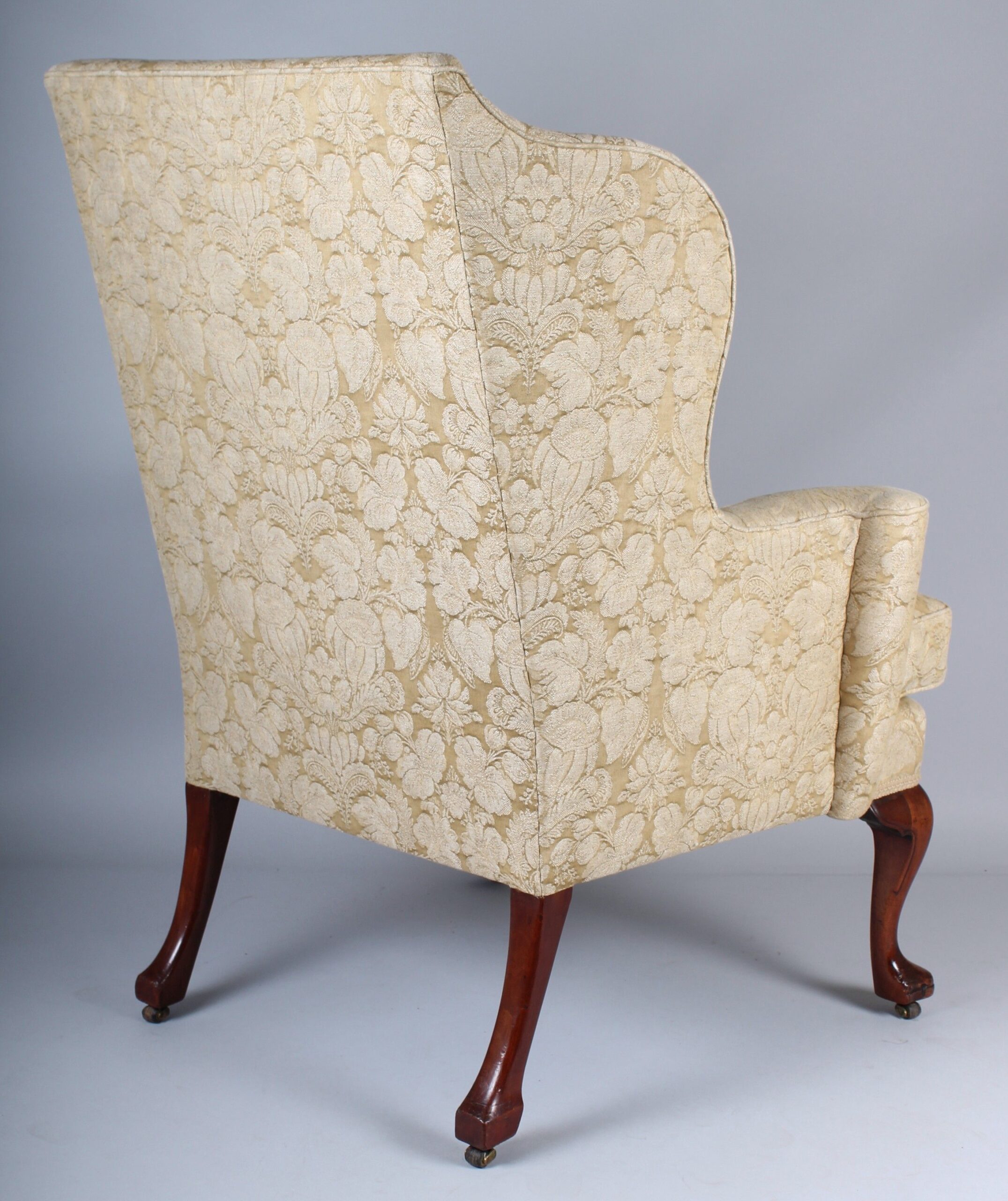 Wing arm-chair on walnut cabriole legs in the classic Queen Anne style