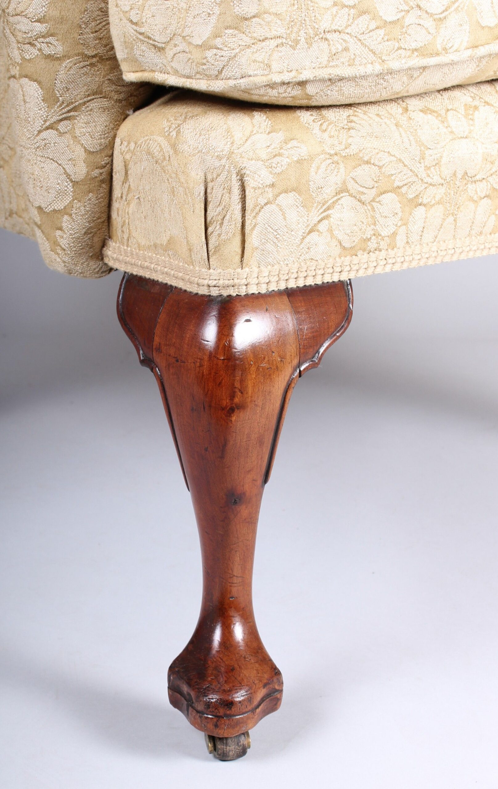 Wing arm-chair on walnut cabriole legs in the classic Queen Anne style