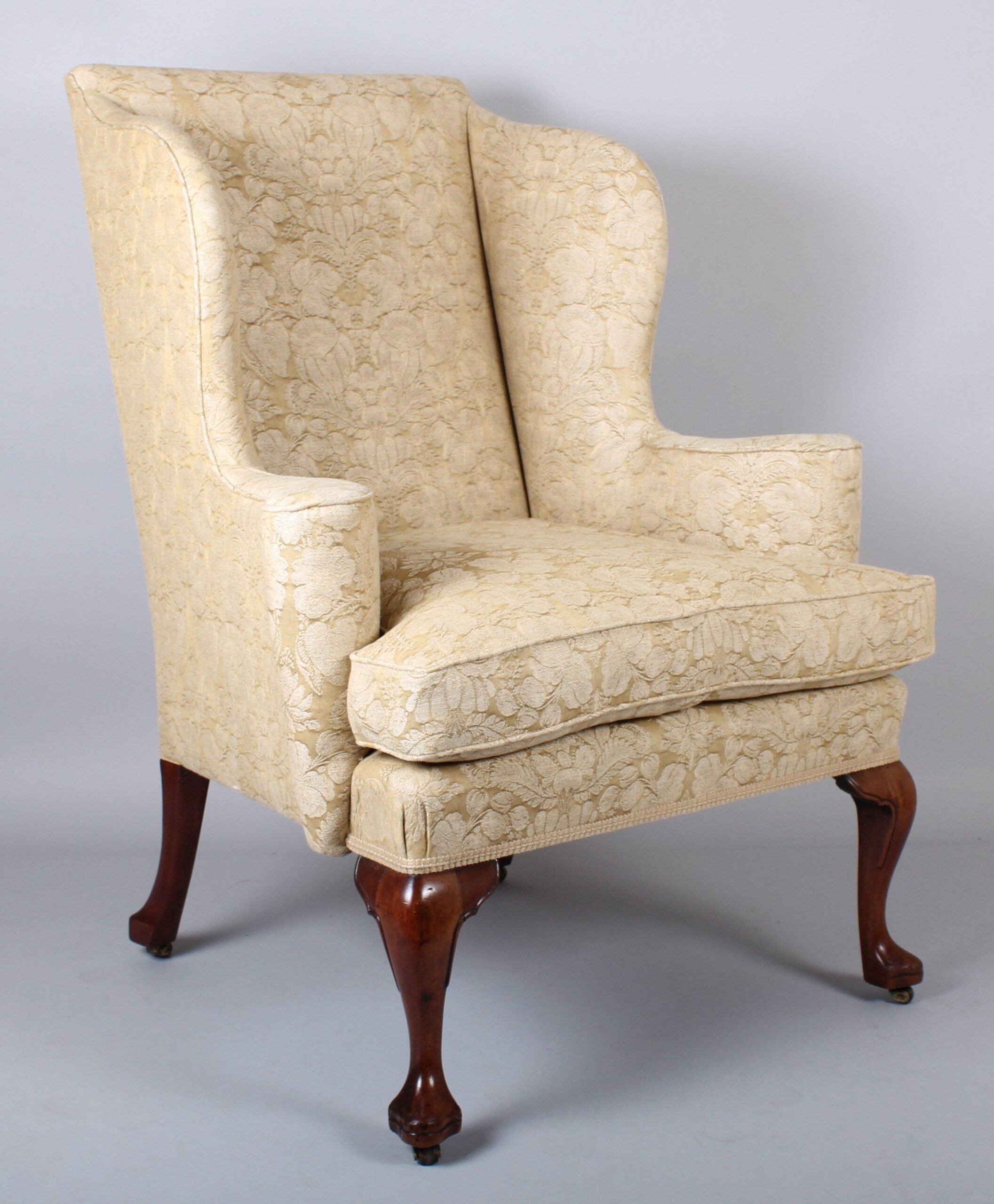Wing arm-chair on walnut cabriole legs in the classic Queen Anne style