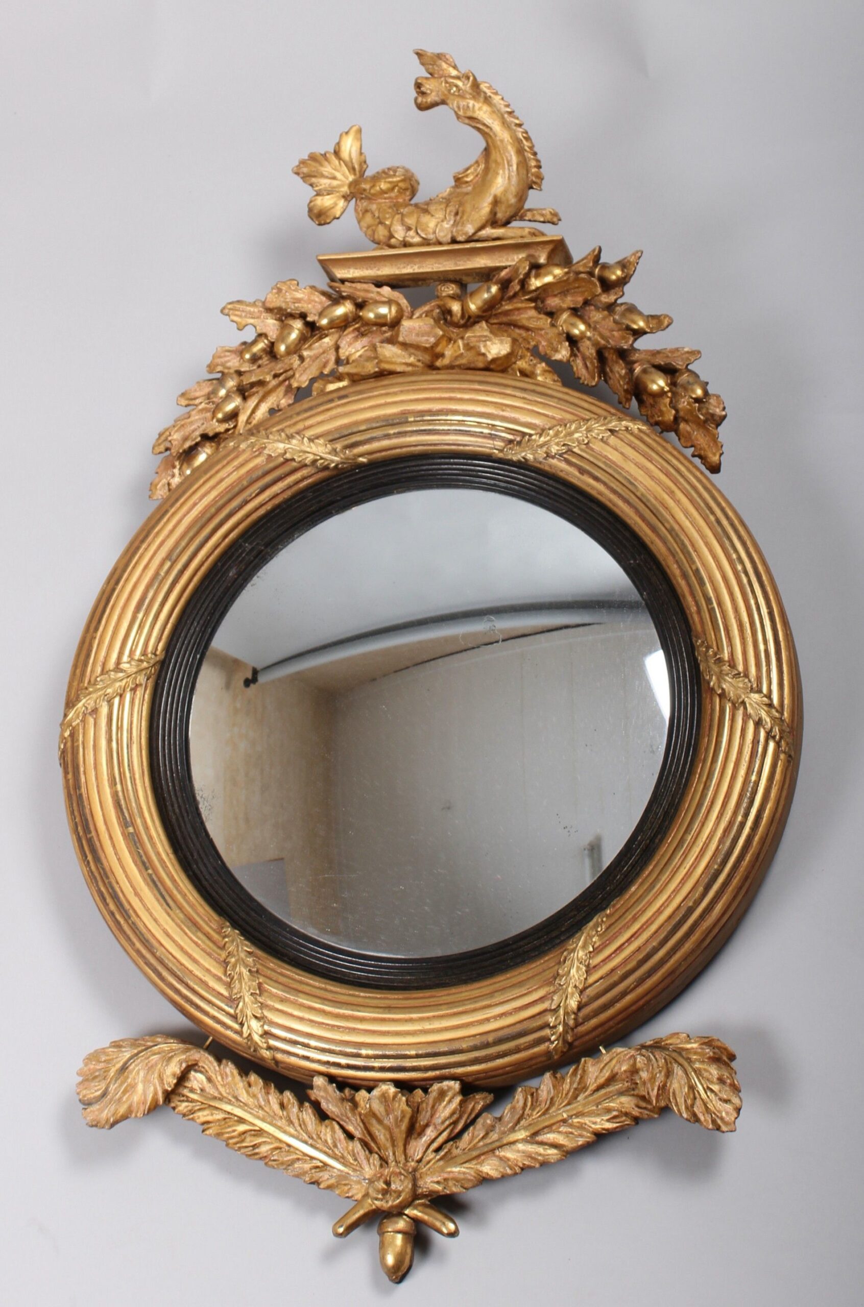 Regency period carved and gilt wood convex mirror