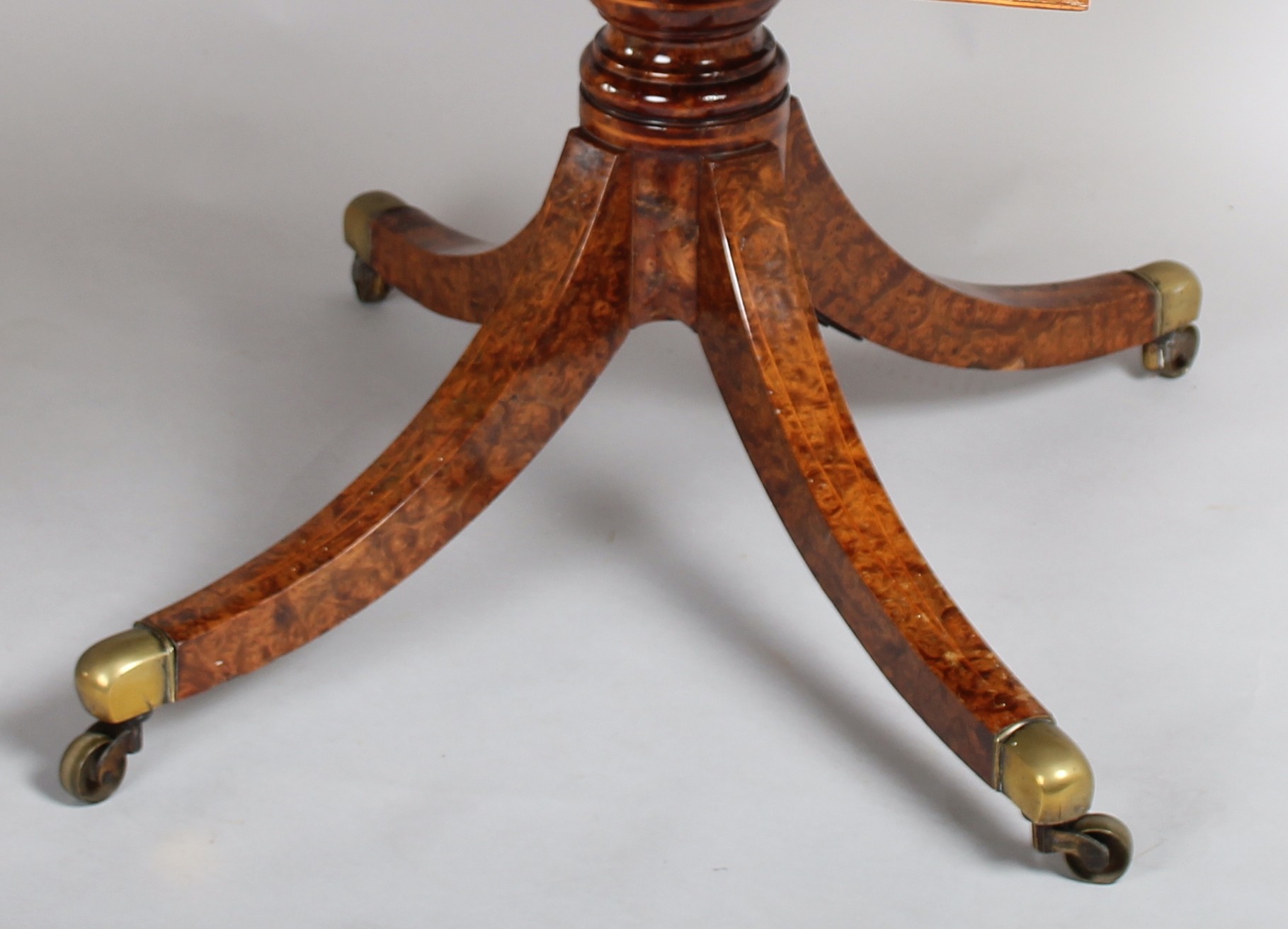 A spectacular Regency burr elm Pembroke table