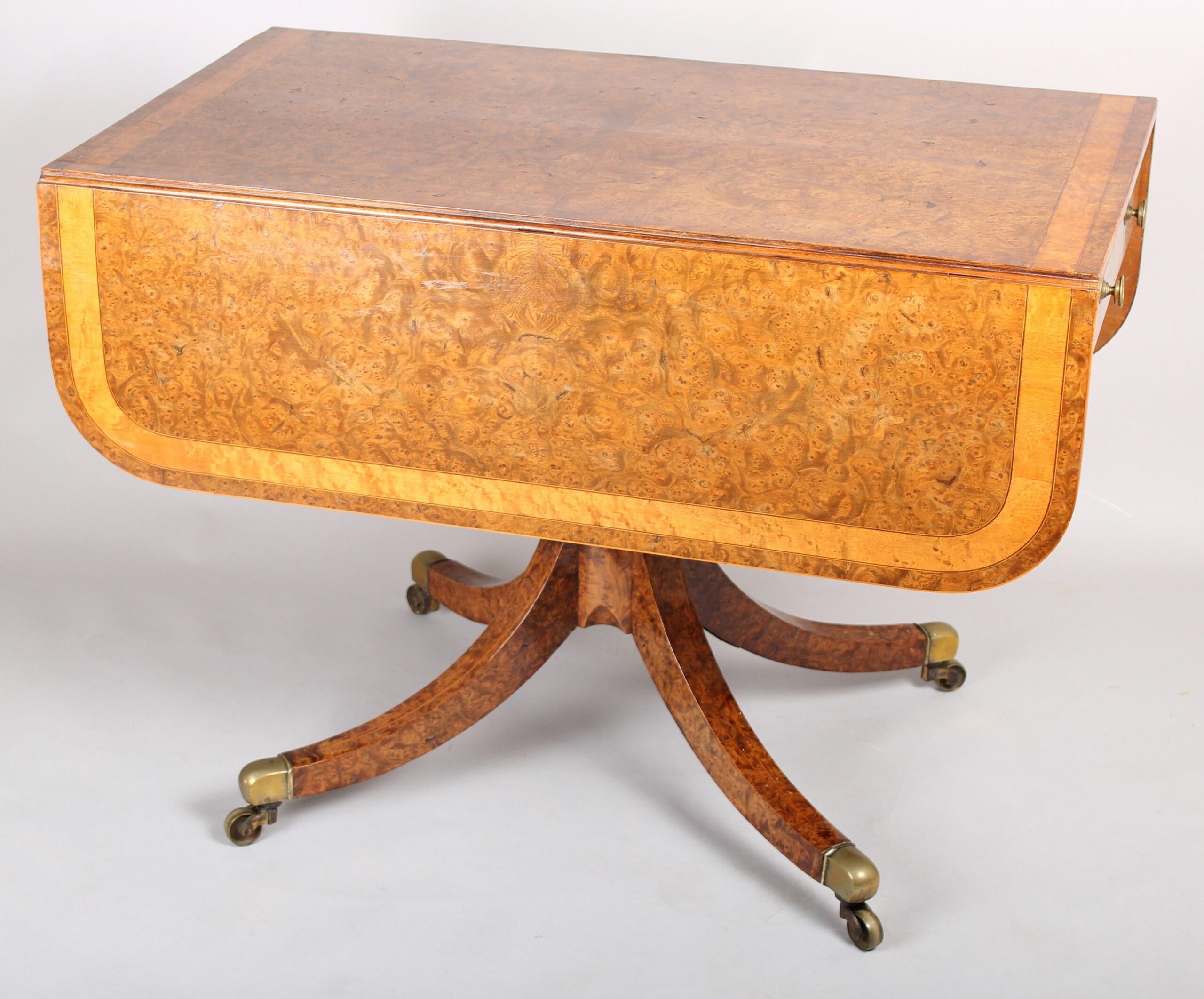 A spectacular Regency burr elm Pembroke table