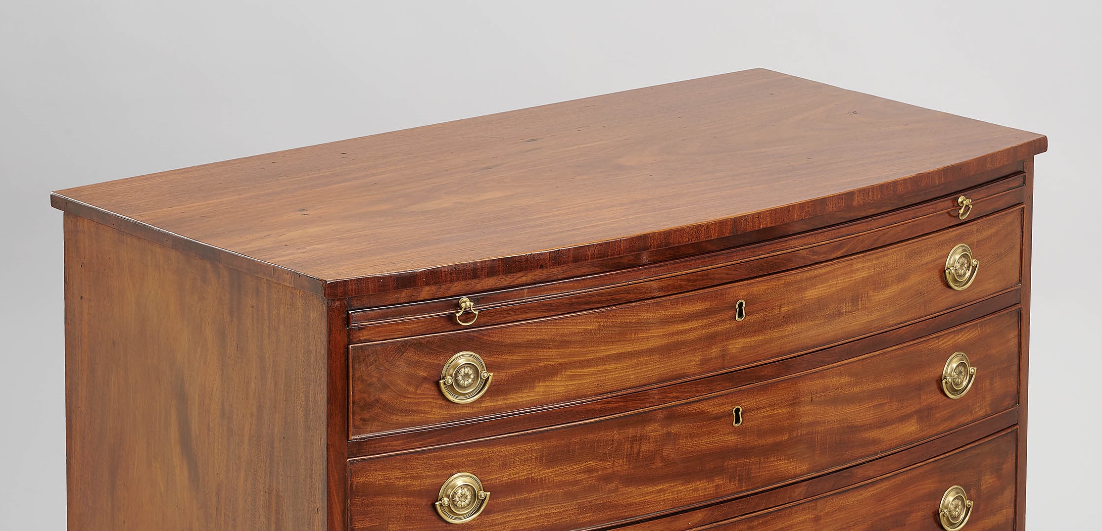 Rare pair of George III period mahogany bow-fronted chests-of-drawers