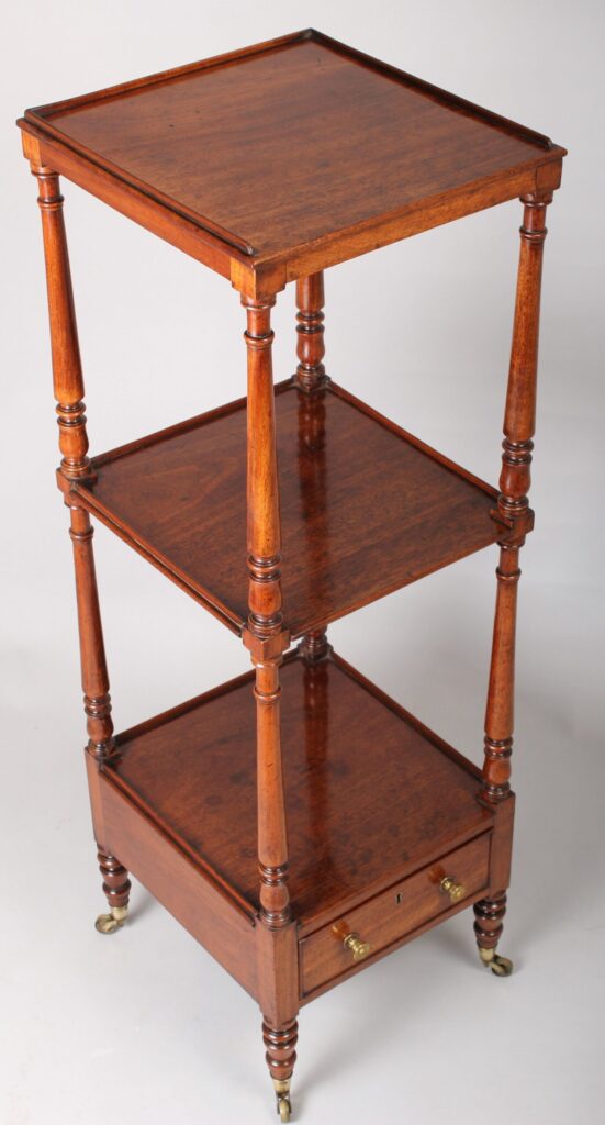 A late George III period mahogany small whatnot