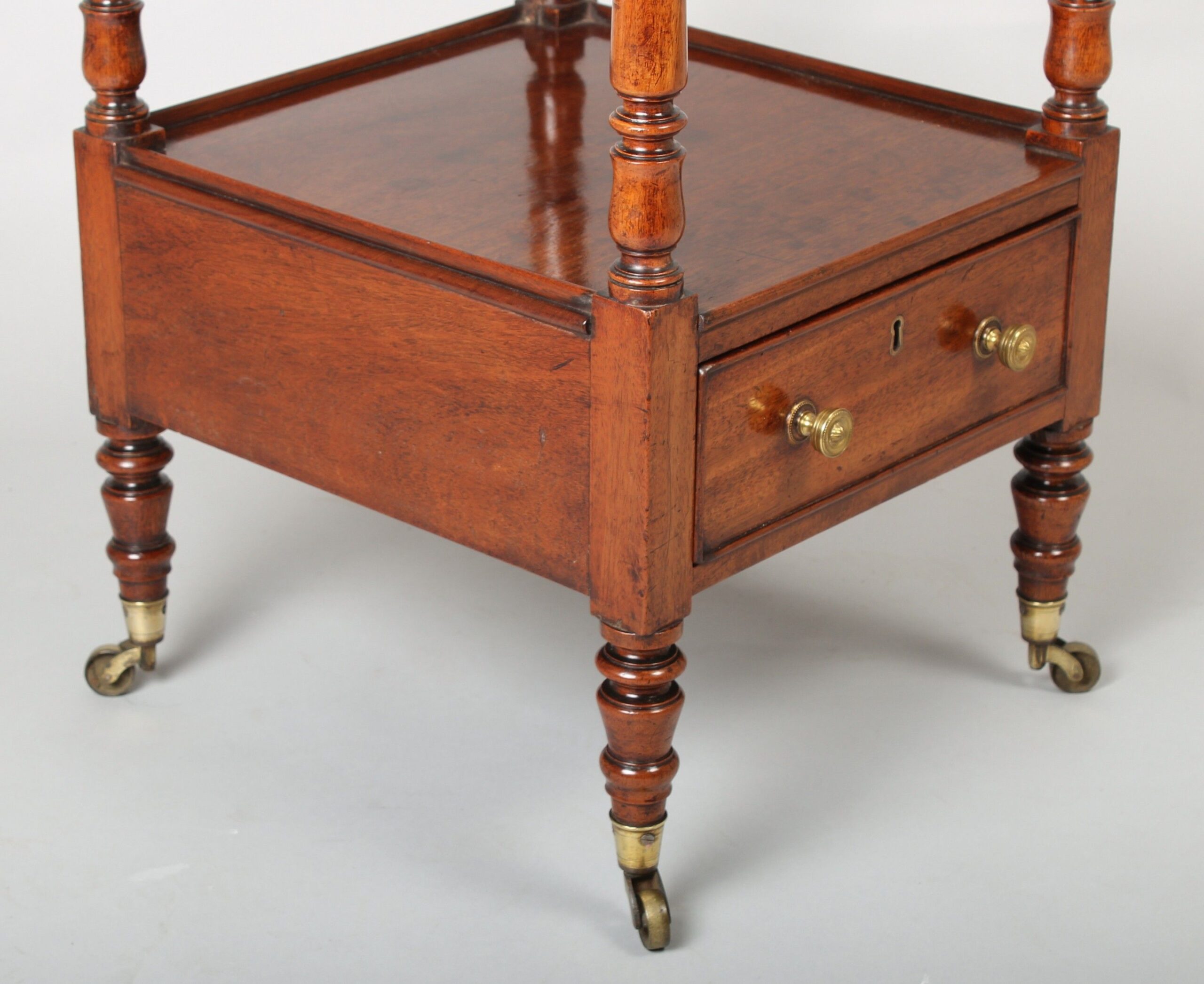 A late George III period mahogany small whatnot