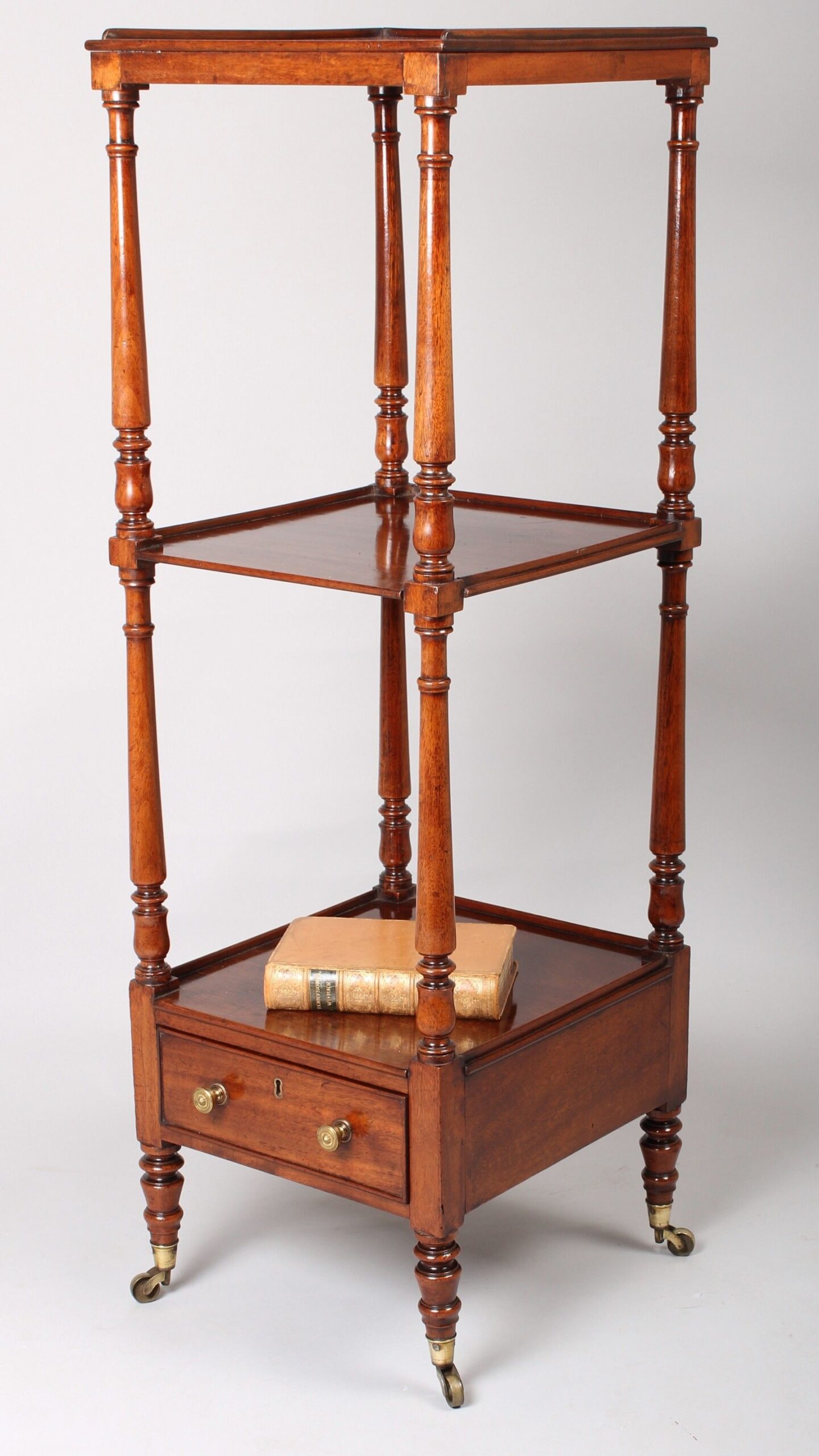 A late George III period mahogany small whatnot