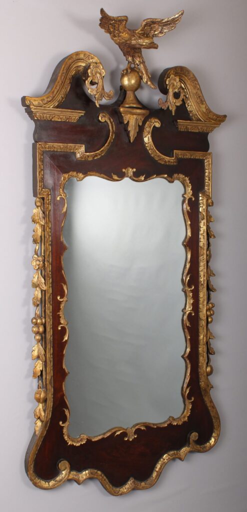 A fine and handsome George II period mahogany and parcel-gilt mirror