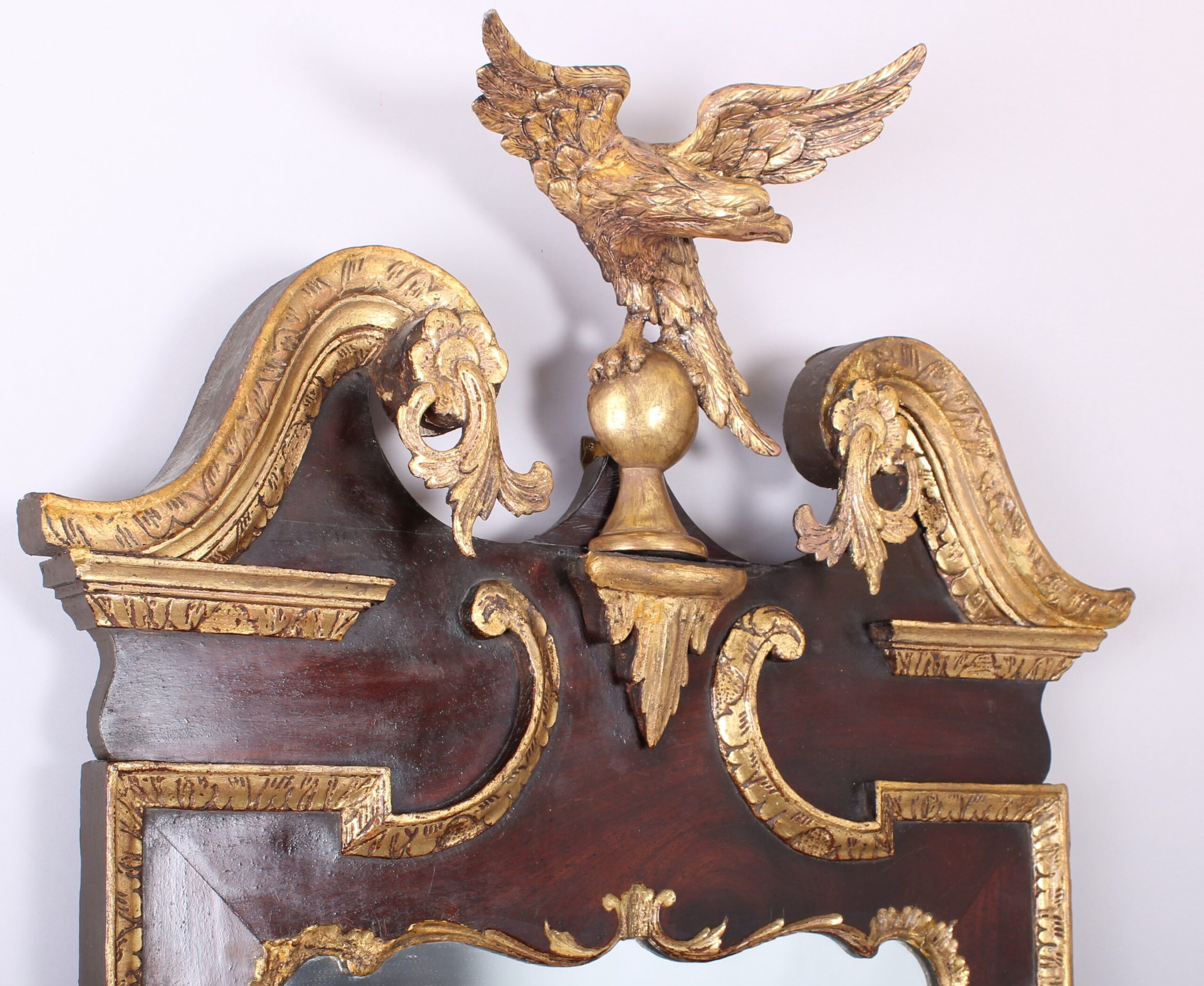 A fine and handsome George II period mahogany and parcel-gilt mirror