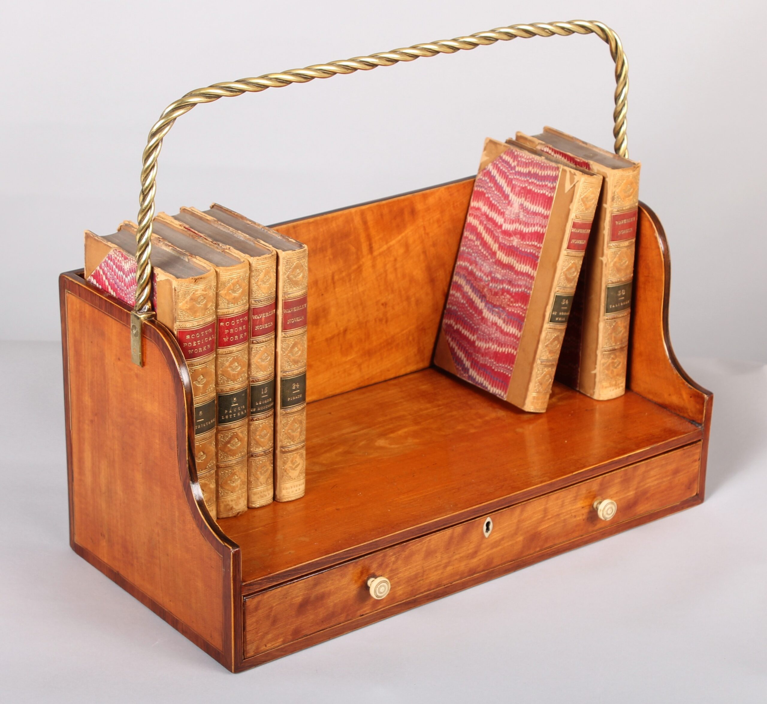 Fine and rare George III period satinwood book-carrier in the Sheraton manner