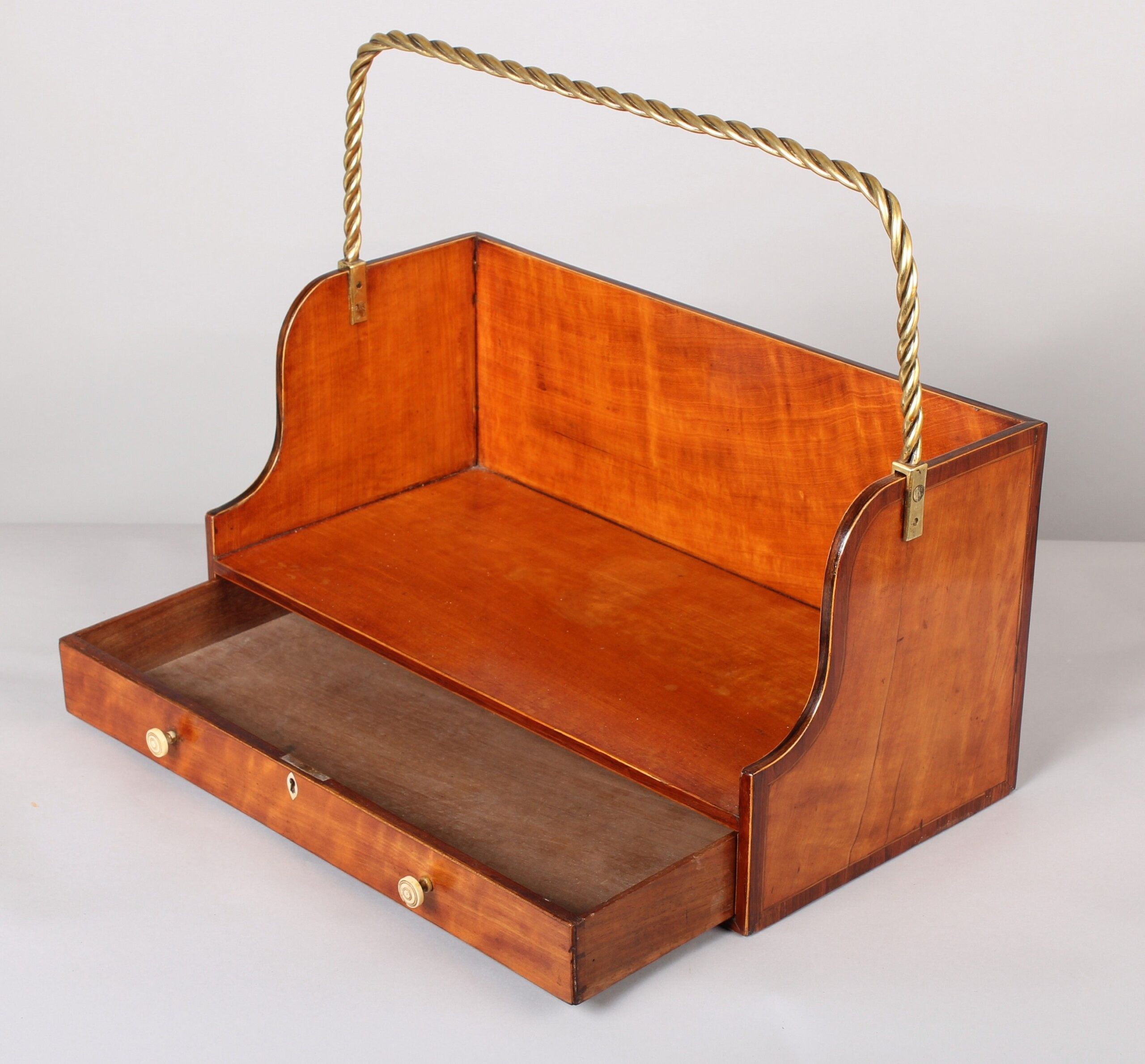 Fine and rare George III period satinwood book-carrier in the Sheraton manner