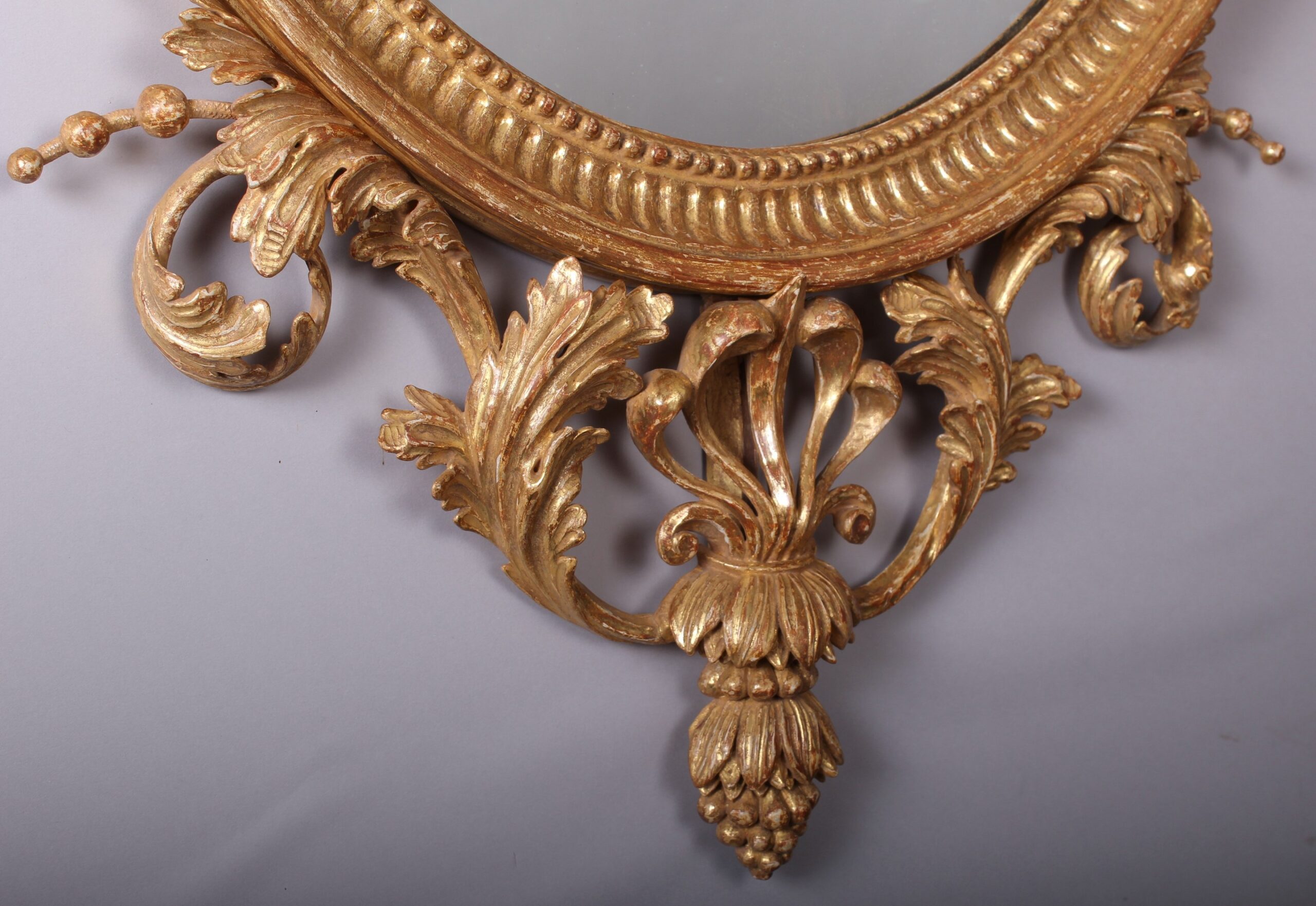 A fine quality and decorative carved and gilt mirror in the neo-classical style