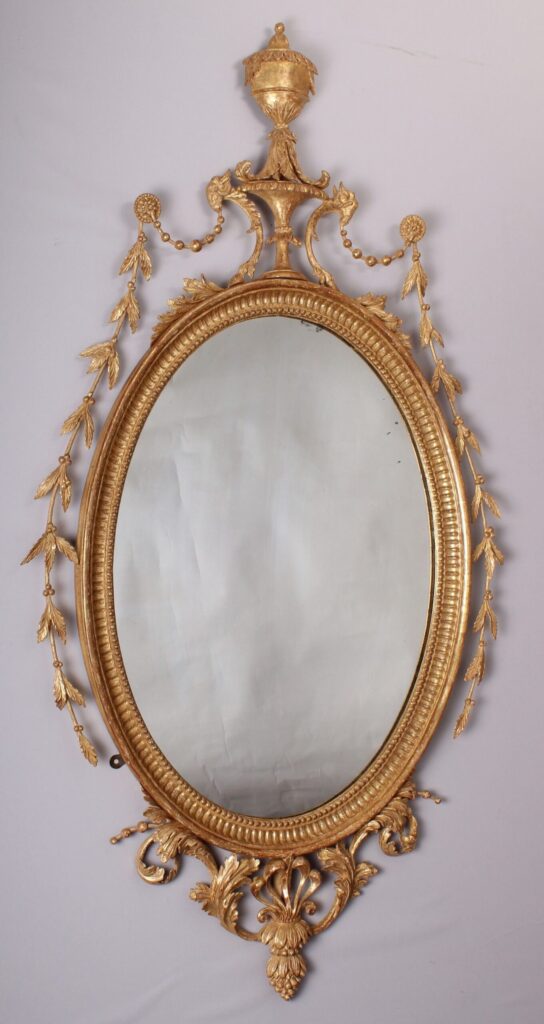 A fine quality and decorative carved and gilt mirror in the neo-classical style