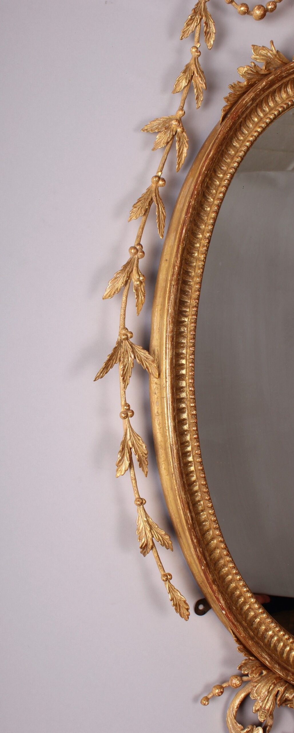 A fine quality and decorative carved and gilt mirror in the neo-classical style