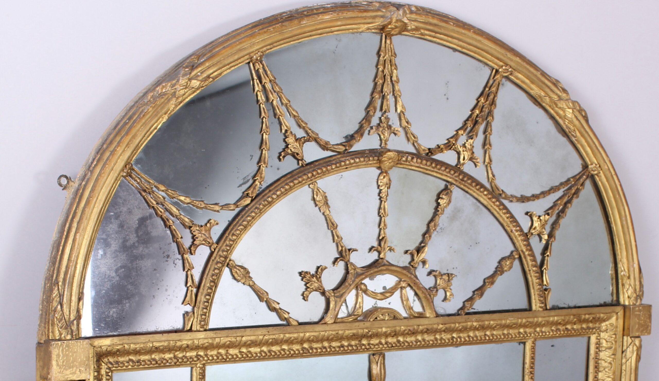 Fine and rare early 19th century gilded overmantel mirror in the neo-classical Adam manner by ‘Freeman of Norwich’