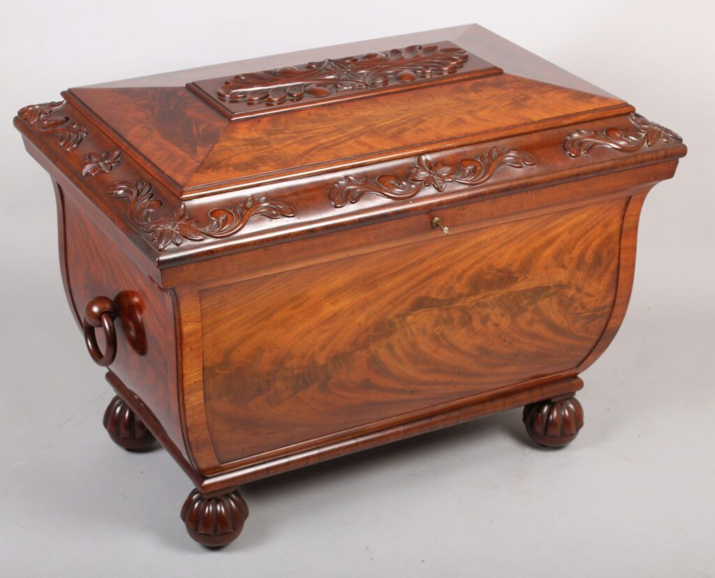 Fine and high quality George IV period mahogany cellarette of richly figured timber