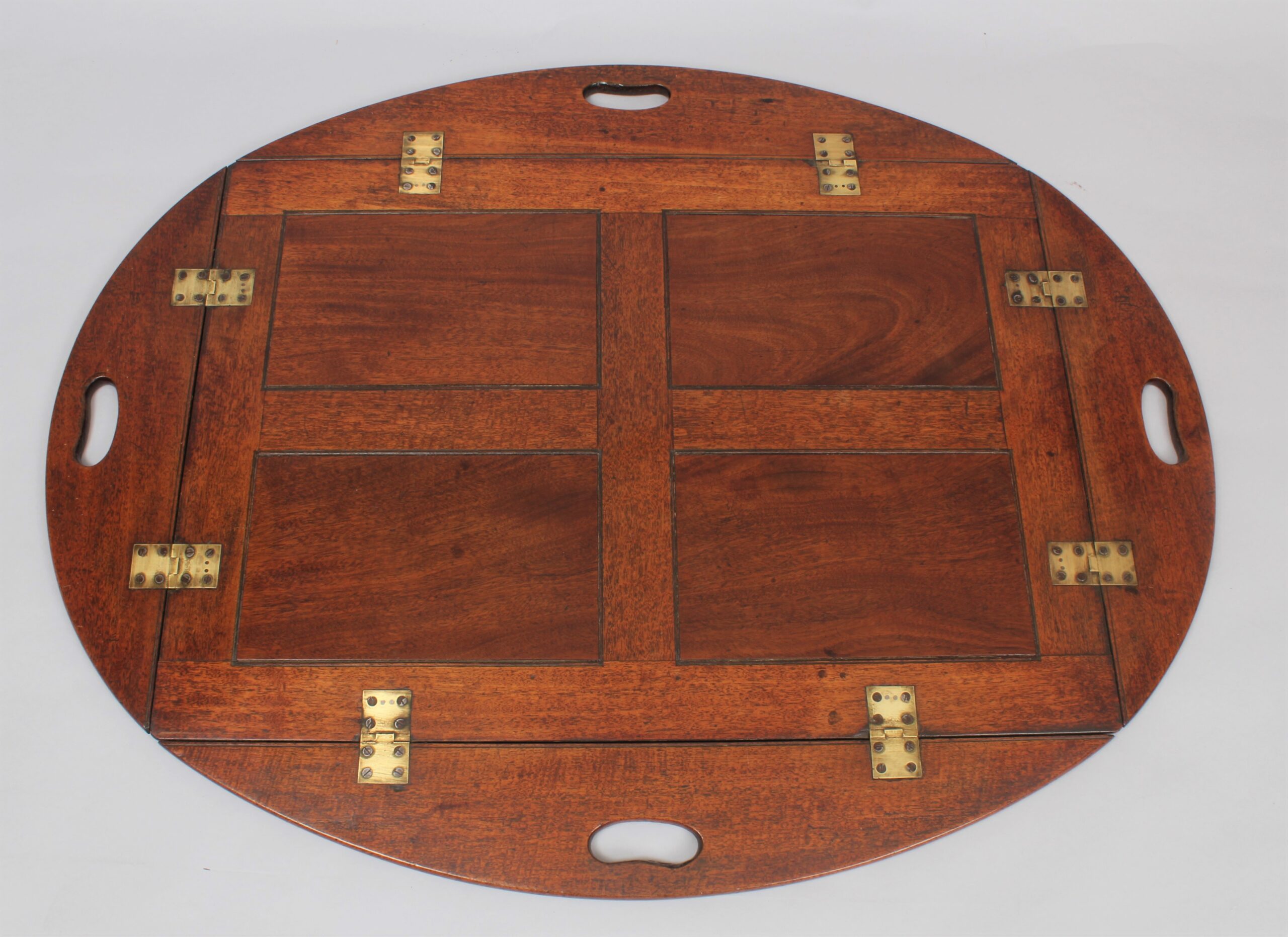 A nineteenth century mahogany oval drop-side Butler’s tray and stand